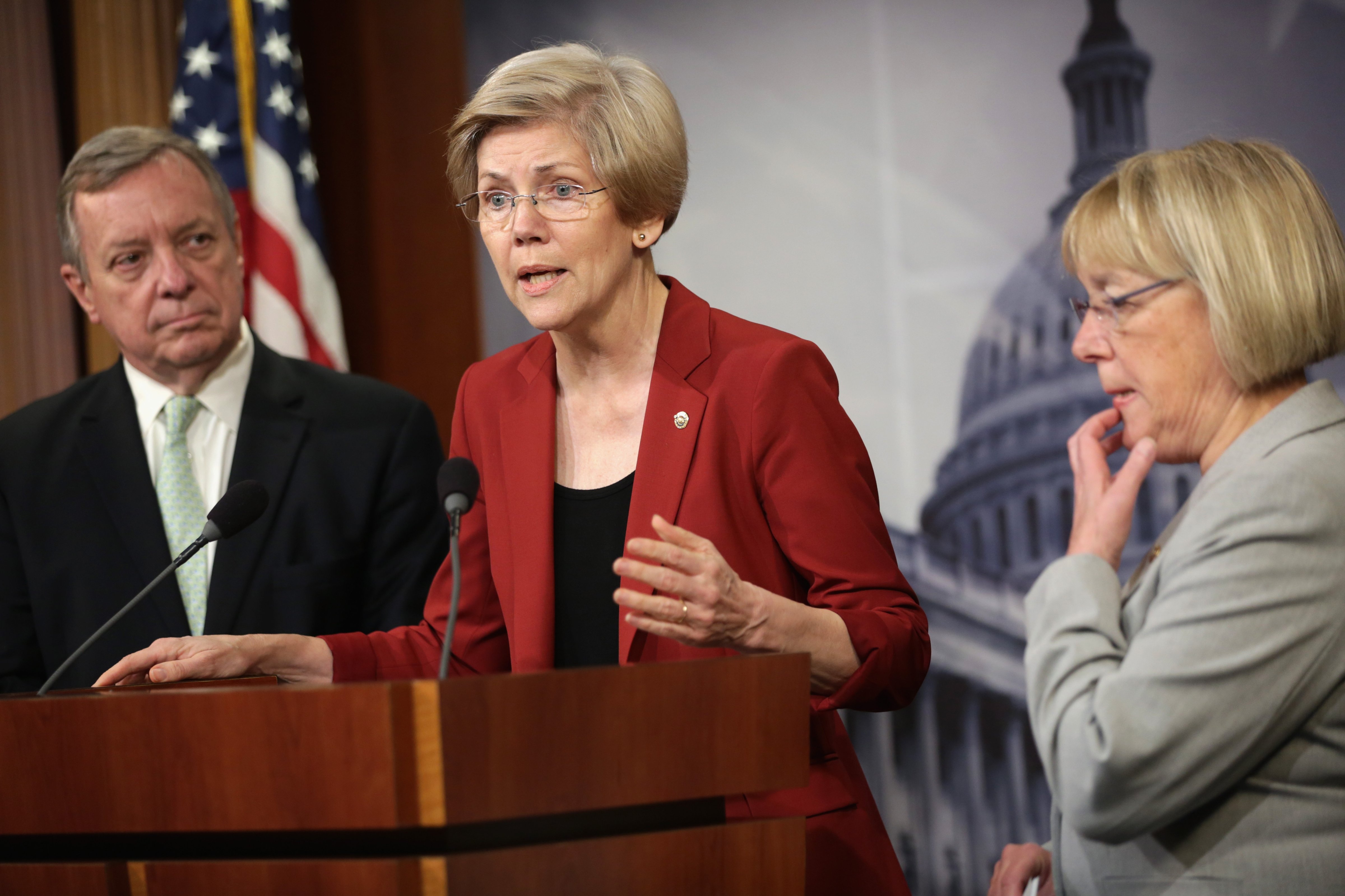 U.S. Sen. Elizabeth Warren (D-MA) (2nd L) speaks as Senate Majority Whip Sen. Richard Durbin (D-IL) (L), and Sen. Patty Murray (D-WA) (R) listen during a news conference June 5, 2014 on Capitol Hill in Washington, D.C. (Alex Wong—Getty Images)