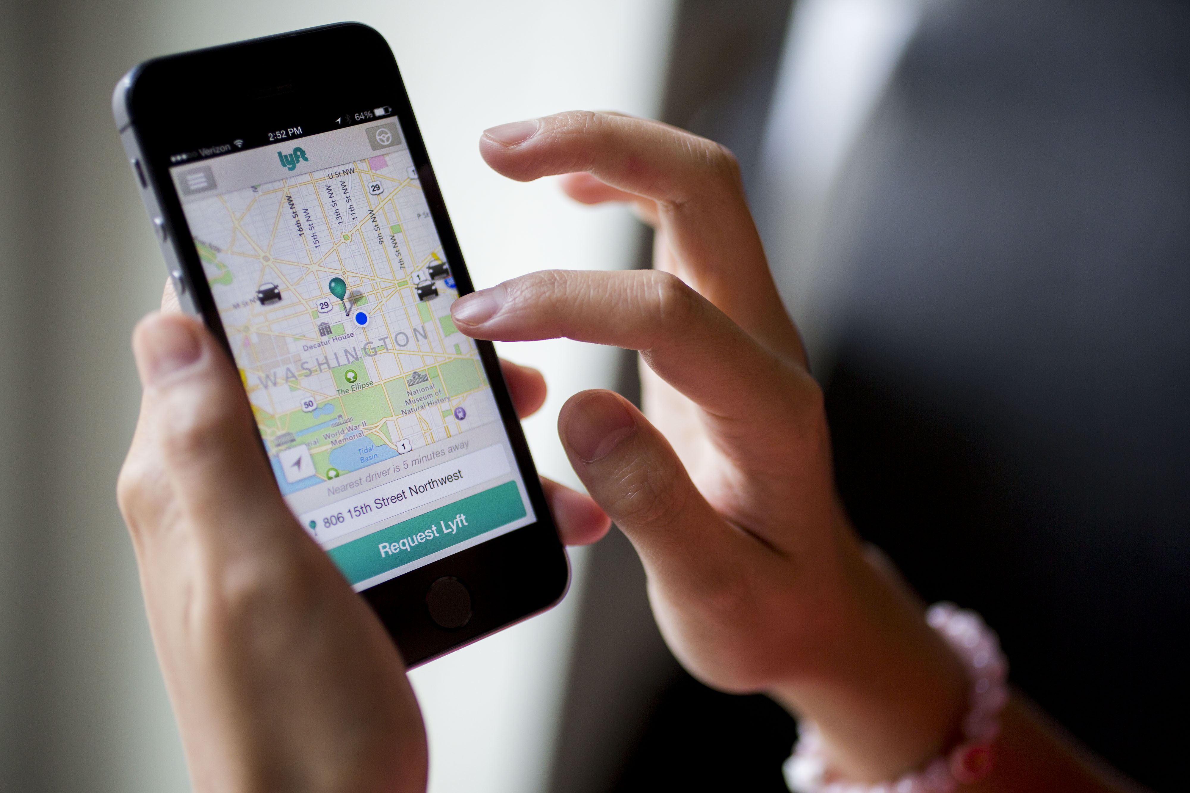 The Lyft Inc. application (app) is demonstrated on an Apple Inc. iPhone 5s for an arranged photograph in Washington, D.C., U.S., on Wednesday, July 9, 2014. (Bloomberg—Bloomberg via Getty Images)