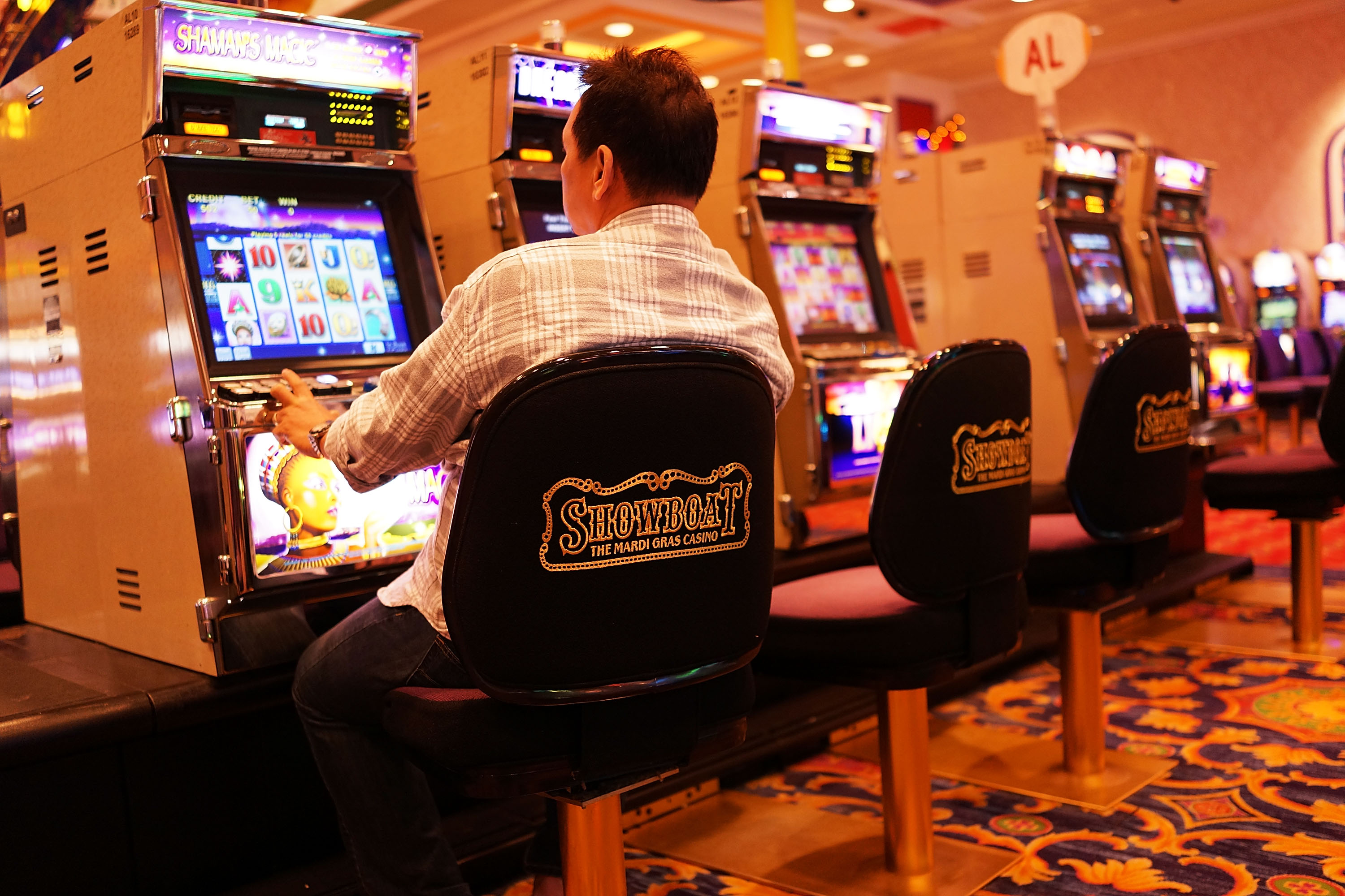 A man gambles at the Showboat casino, which is scheduled to close, in Atlantic City, N.J., on July 29, 2014 (Spencer Platt—Getty Images)