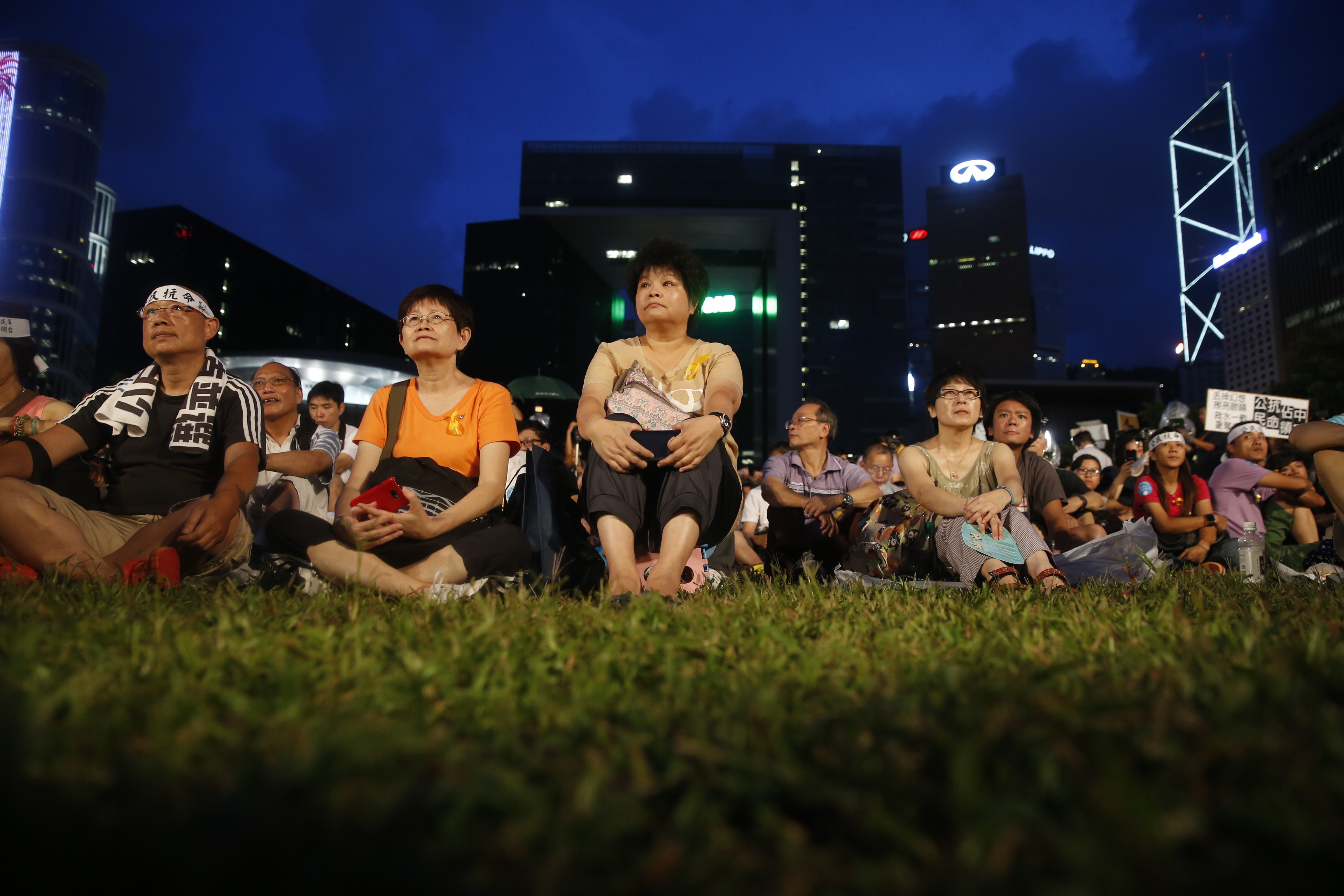 Pro-democracy activists gather during a rally organized by activist group Occupy Central With Love and Peace (OCLP) outside the offices of Chief Executive Leung Chun-ying in Hong Kong, China, on Sunday, Aug. 31, 2014. (Bloomberg—Bloomberg via Getty Images)
