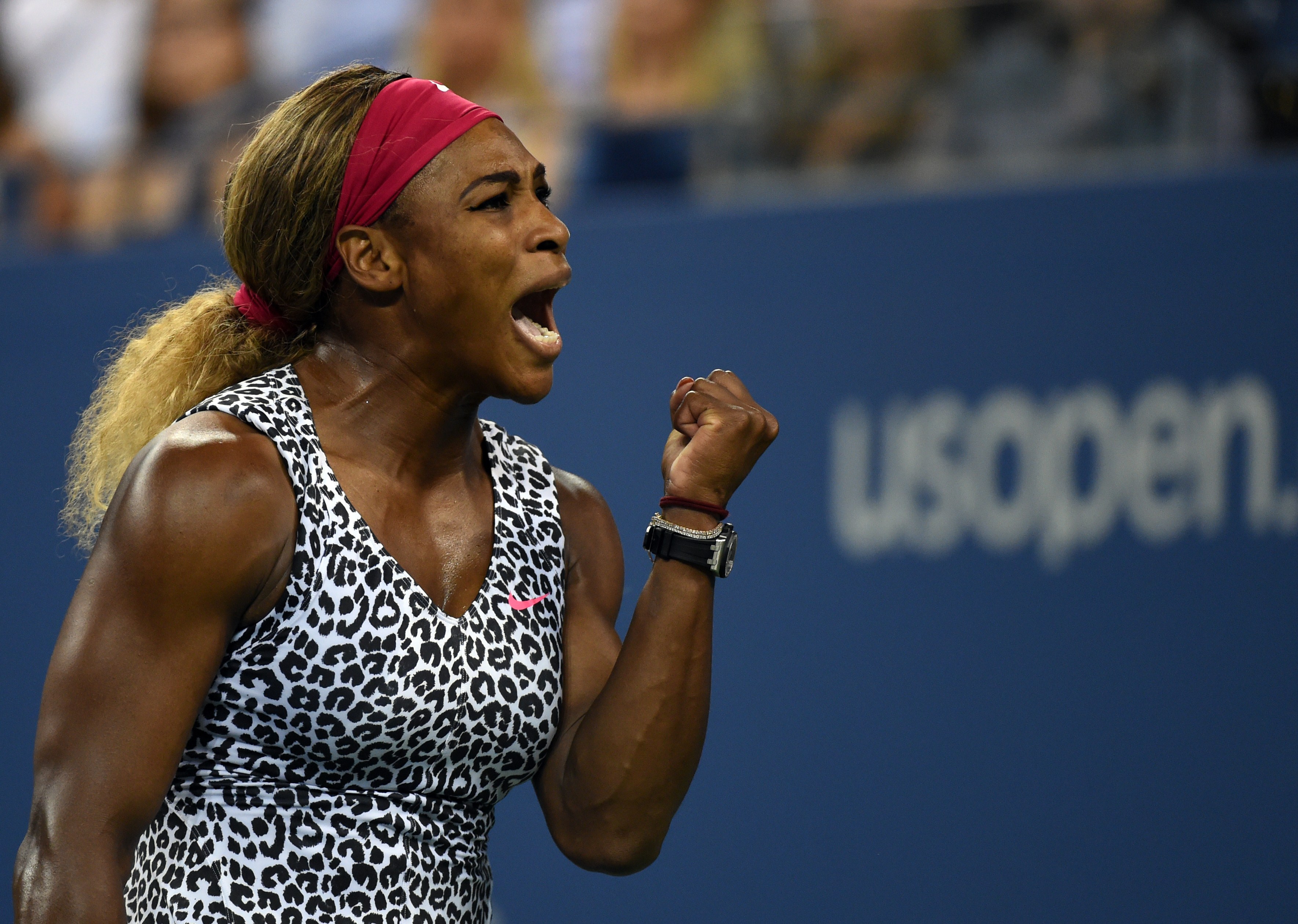Serena Williams of the US celebrates the first set point against Flavia Pennetta of Italy during their US Open 2014 women's quarterfinals match at the USTA Billie Jean King National Center September 3, 2014  in New York. (Don Emmert—AFP/Getty Images)