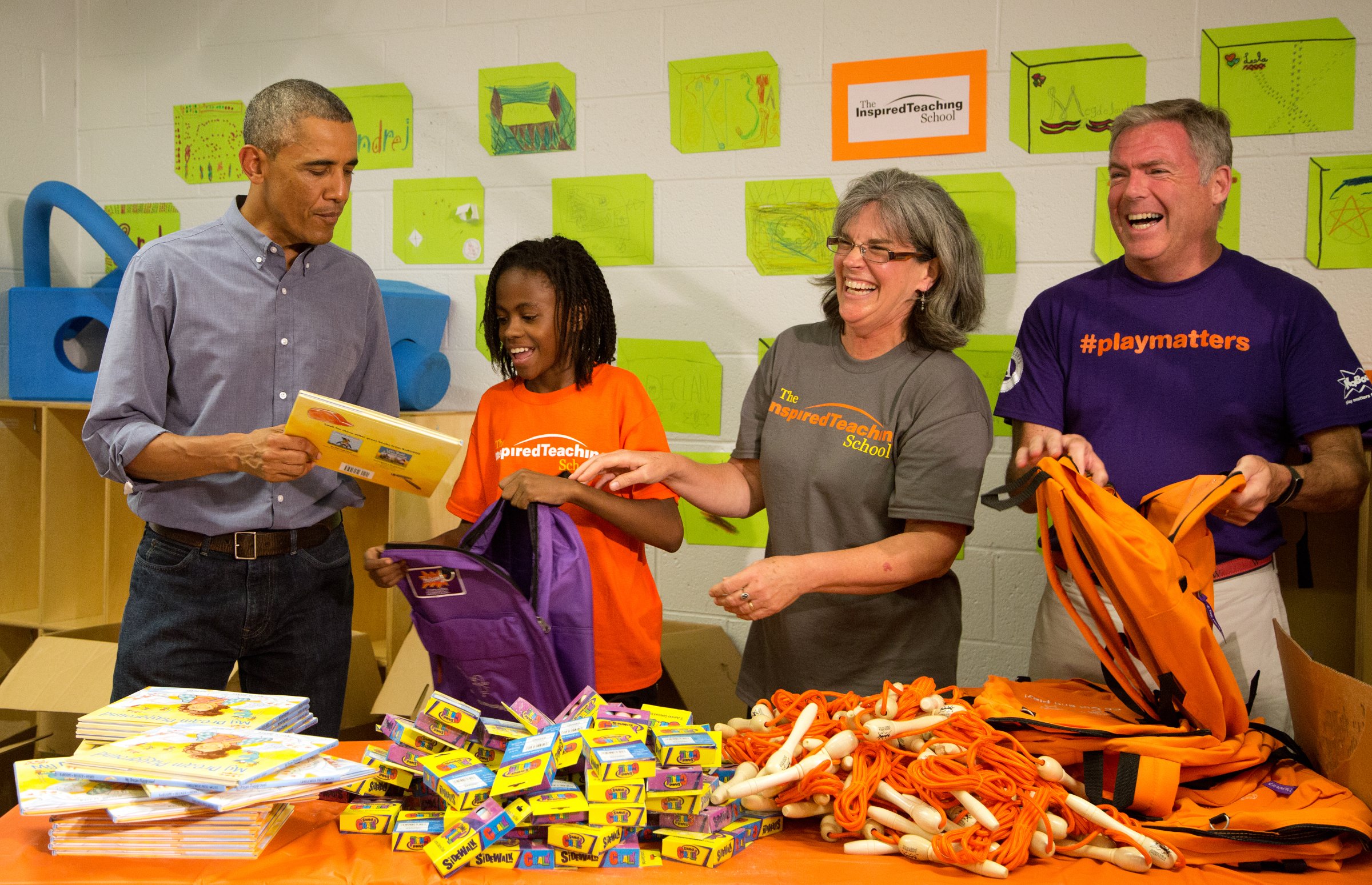 President Barack Obama and volunteers take part in a service project at the Inspired Teaching School in Washington, D.C. on September 11, 2014.