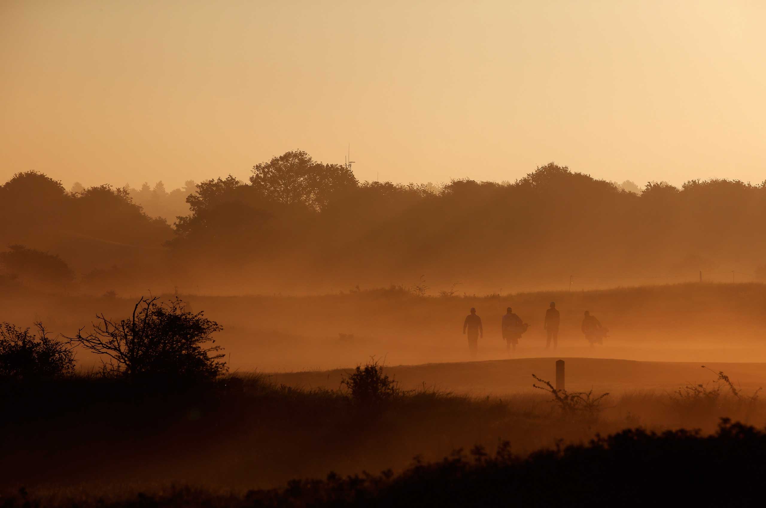 Sept. 12, 2014. Players walk in the mist at the 13th hole during Day 2 of the KLM Open held at De Kennemer Golf and Country Club on  in Zandvoort, Netherlands.