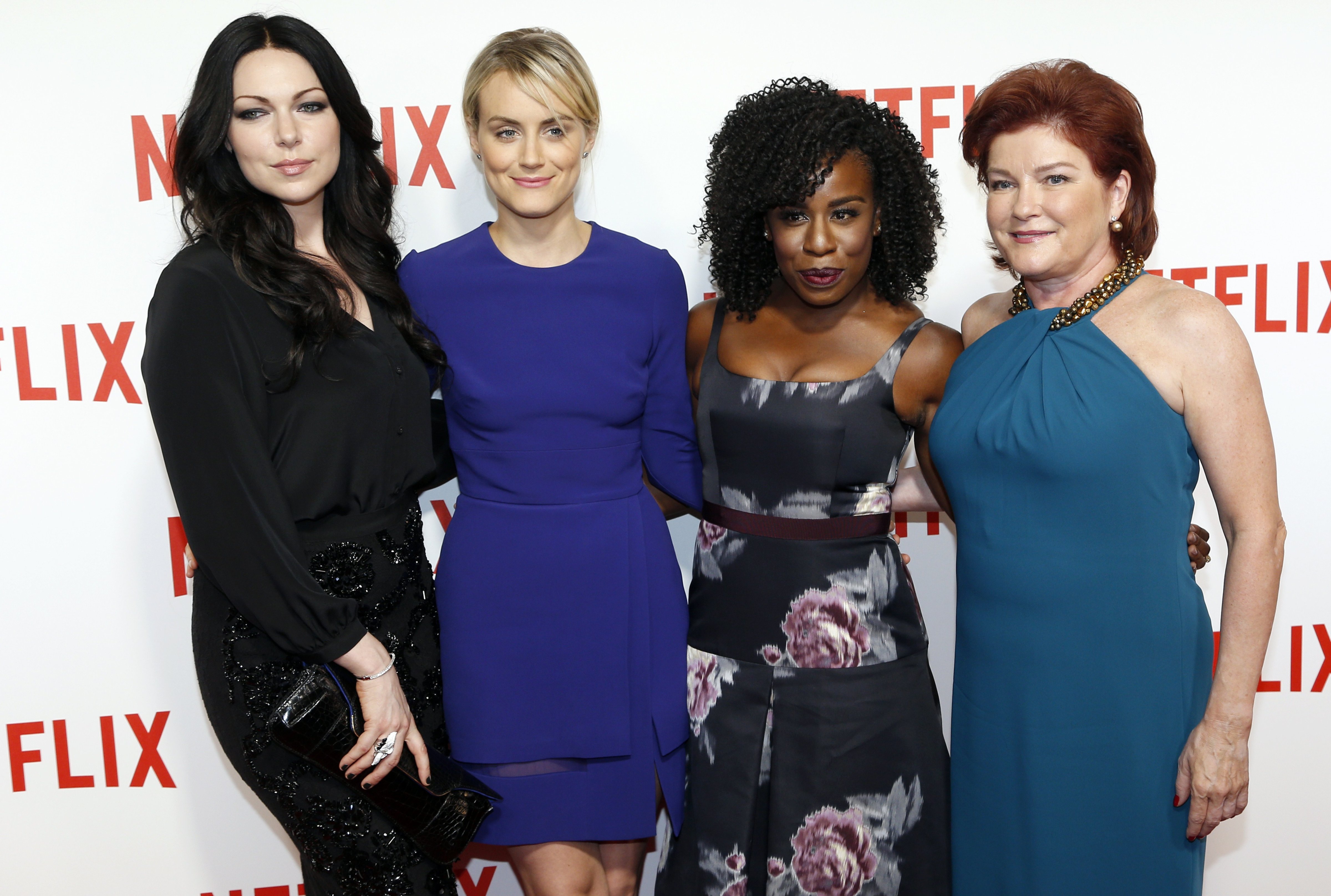"Orange is the New Black" cast members US actresses Laura Prepon, Taylor Schilling, Uzo Aduba and Kate Mulgrew pose during a photocall for the launch of Netflix in France on September 15, 2014 in Paris. (Francois Guillot—AFP/Getty Images)
