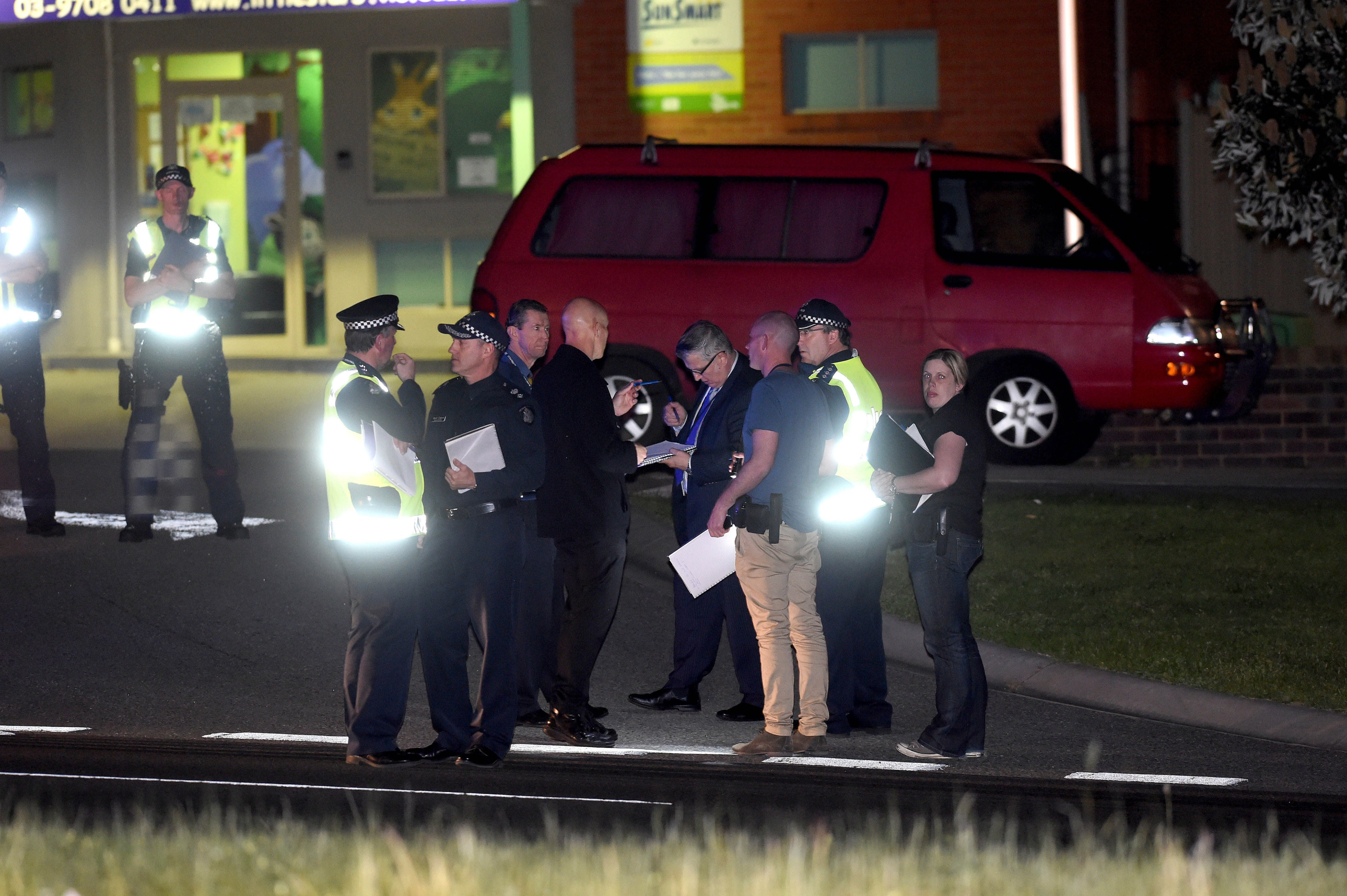 Investigators at the scene after a teenage terror suspect was shot dead after stabbing a Victorian officer and a federal police agent outside Endeavour Hills police station on September 23, 2014 in Melbourne, Australia. (Newspix—Newspix via Getty Images)