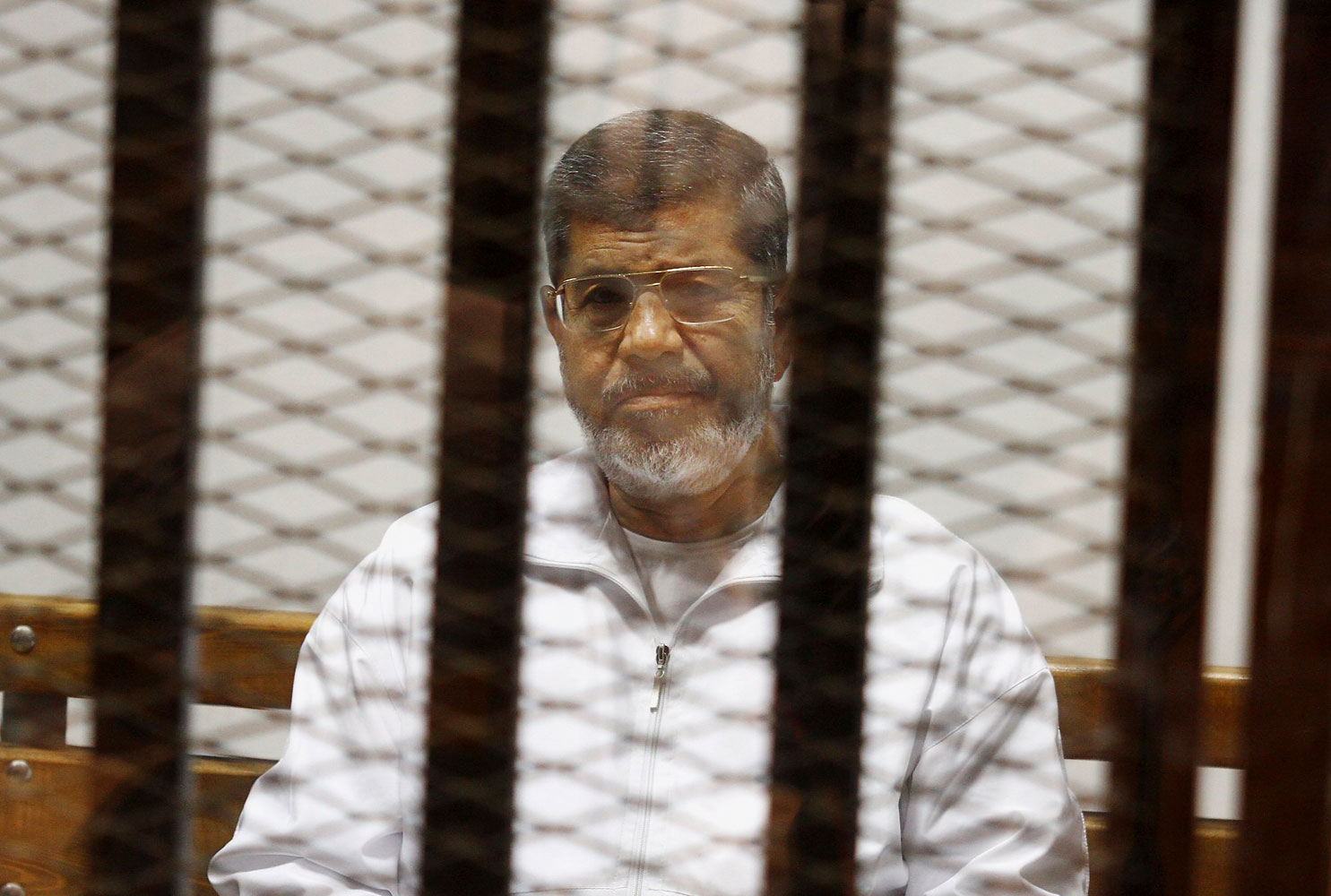 Egypt's ousted Islamist President Mohammed Morsi sits in a defendant cage in the Police Academy courthouse in Cairo, May 8, 2014. (Tarek el-Gabbas—AP)