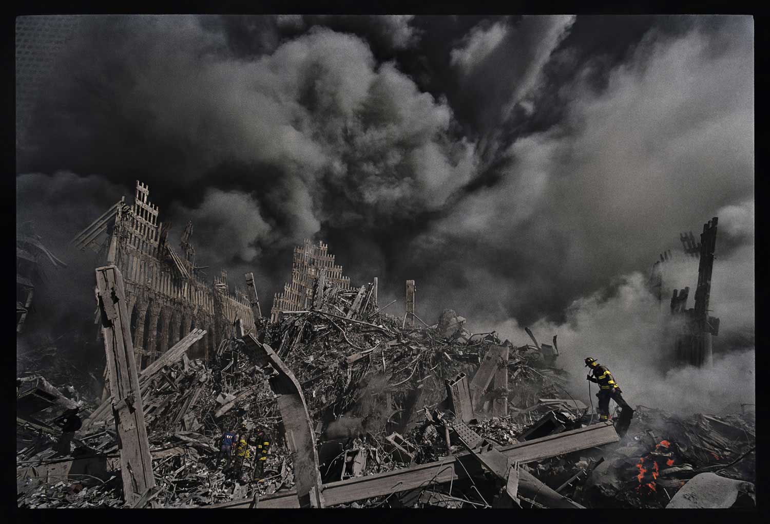 MaryAnne Golon, photo editor and media consultant; former Director of Photography of TIME
                              
                               James Nachtwey's photograph here of one tiny New York City fireman making his way through the inferno that was once the World Trade Center towers is forever seared into my memory from the darkest day in American history, 9/11/2001. Later on that evening, Jim, completely covered in ash from the fallen World Trade Center towers, arrived in person at the Time and Life building in midtown Manhattan to deliver his exposed film to his waiting editors. While his film was being processed, he drank a large bottle of water, and slumped exhausted in a dark green chair in the Time photo department hallway. The following morning, the imprint of his body on the chair and his dusty footprints were still there. Then editor-in-chief Norman Pearlstine and his deputy, John Huey, came by to see where the great photographer had walked.  James Kelly, the finest news magazine editor in America, chose to run many of Jim's pictures in the 9/11 black-bordered issue of TIME Magazine that memorialized that tragic event. I was honored to have been the picture editor of that edition and to be the first person in the world to have seen Jim's haunting work. It took months for me to grieve as a human being. I was working 80-hour weeks to do my job as a journalist. Jim's work comforted me and helped many Americans to process the hideous aftermath of those horrendous days. Thank you, Jim Nachtwey.
