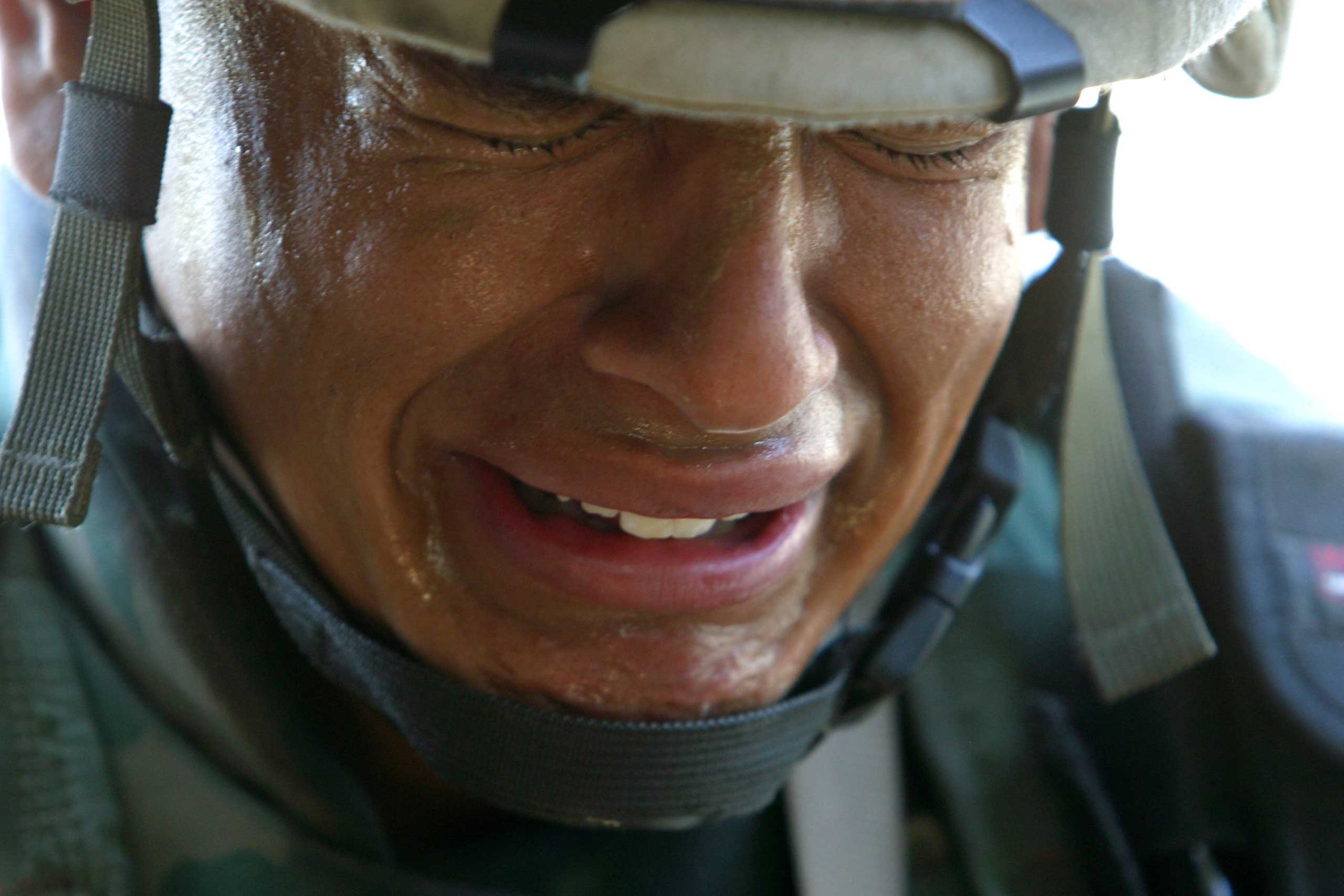 Robert King, June 5, 2004
                              
                              A soldier with Battery B, 3rd Battalion, 112th Field Artillery, Army National Guard of Lawrenceville, N.J. cries as the 1st Cav extract the body of Army Spc. Ryan E. Doltz. Army Spc. Doltz was killed along with Sgt. Humberto Timoteo after an IED exploded under their vehicle during a patrol in Sadr City. 
                              This image was taken a few days after I escaped from being kidnapped in Fallujah. The kidnapping and the threat of being killed was an overwhelming experience that effected me both mentally and physically. Instead of packing it up and exiting this current theater of war, I decided to double down and continue working. By doing so I was able to deal with the physiological impact of the kidnapping in a healthy and productive manner. The image still haunts me, and at times, members of Battery B, 3rd Battalion, 112th Field Artillery, Army National Guard, have reached out to thank me for my work. It brings closure to this horrific tragedy where American heroes gave the ultimate sacrifice to their country.