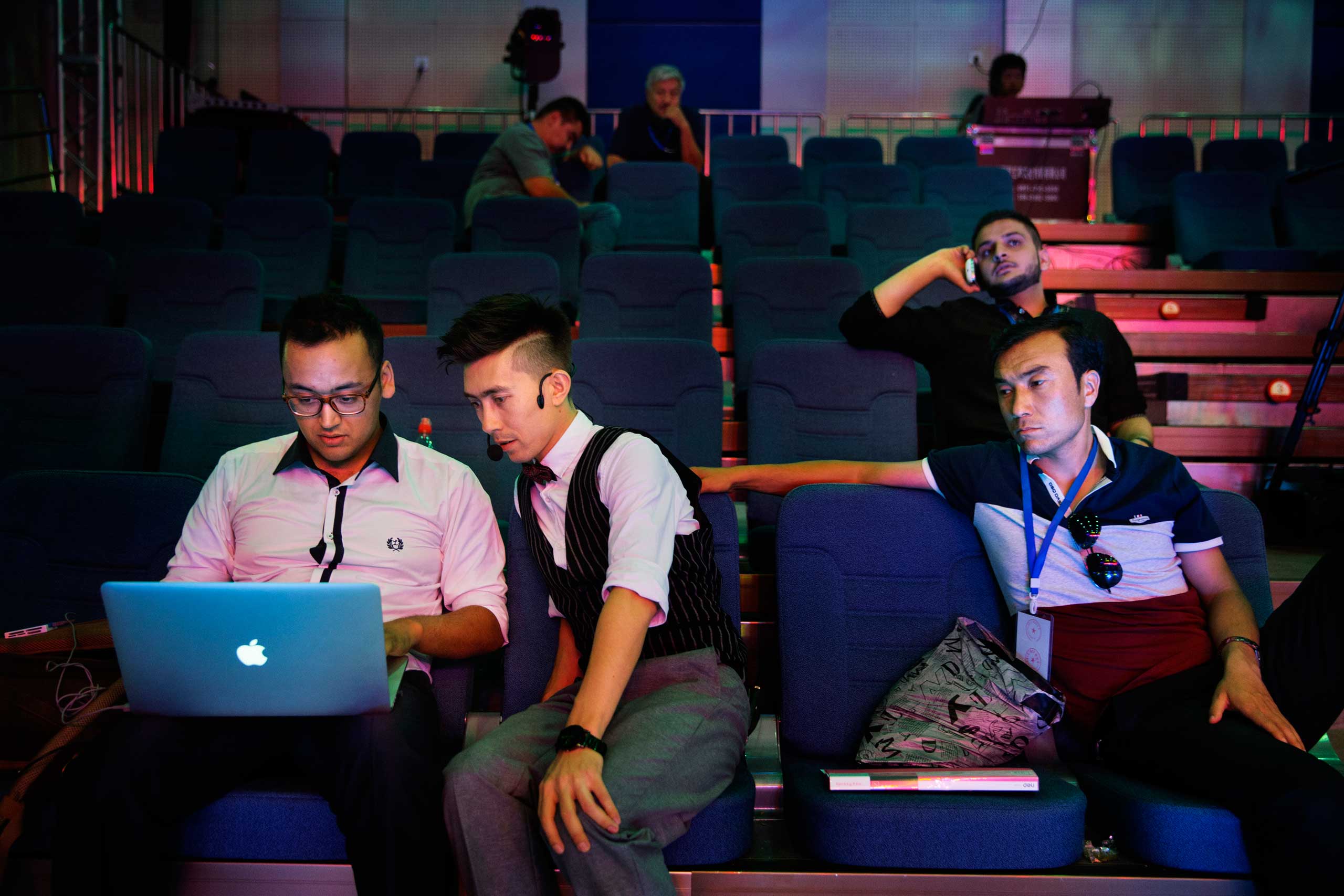 Ablajan checks a video on a laptop at rehearsals for a planned live webcast concert scheduled for that afternoon in Urumqi, China on July 31, 2014.