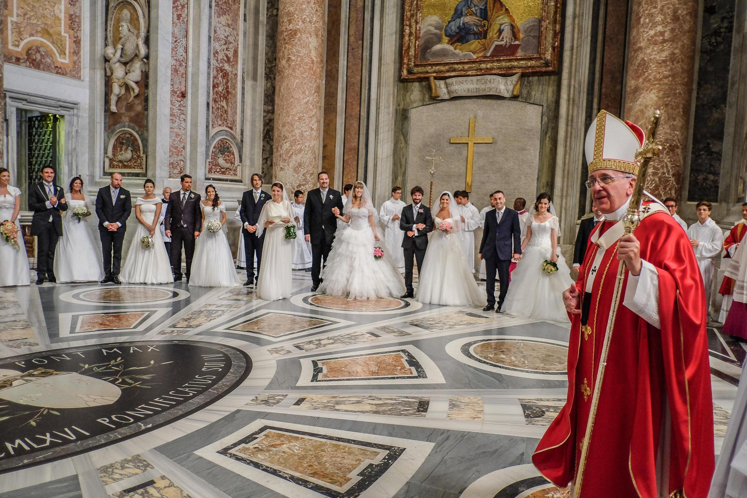 Pope Francis celebrates the wedding of 20 couples in St. Peter's Basilica in Vatican City on Sept. 14, 2014.