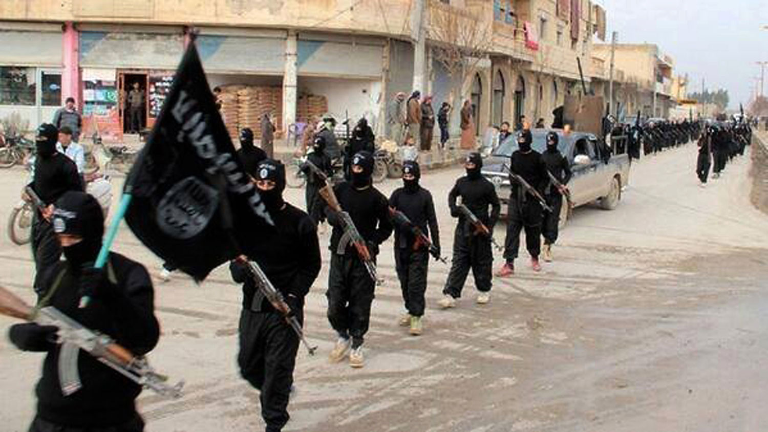 Fighters from the Islamic State of Iraq and Greater Syria marching in Raqqa, Syria, on Jan. 14, 2014 (AP)
