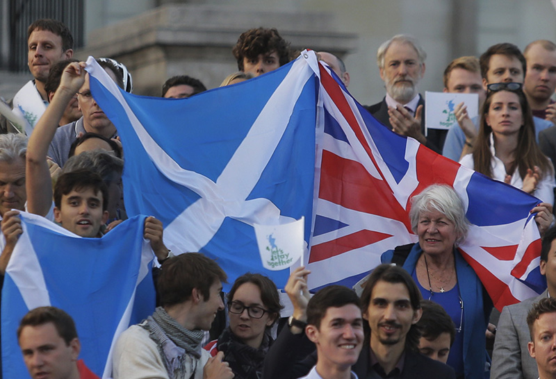 Supporters wave British and Scottish flags at a pro-union rally, at Trafalgar Square in central London on Sept. 15, 2014 (Lefteris Pitarakis—AP)