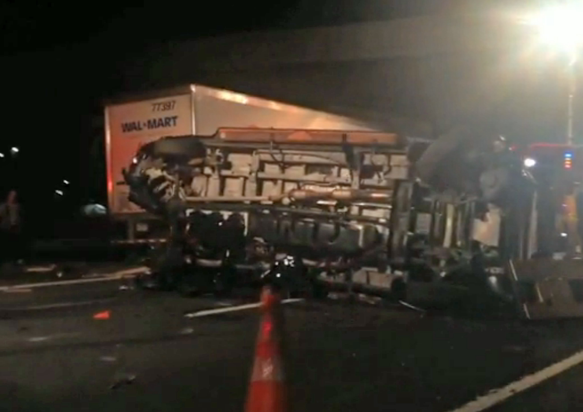 In this image from video the limousine bus carrying Tracy Morgan and six other people lies on it's side early Saturday morning, June 7, 2014, on the New Jersey Turnpike. (Will Vaultz—AP)