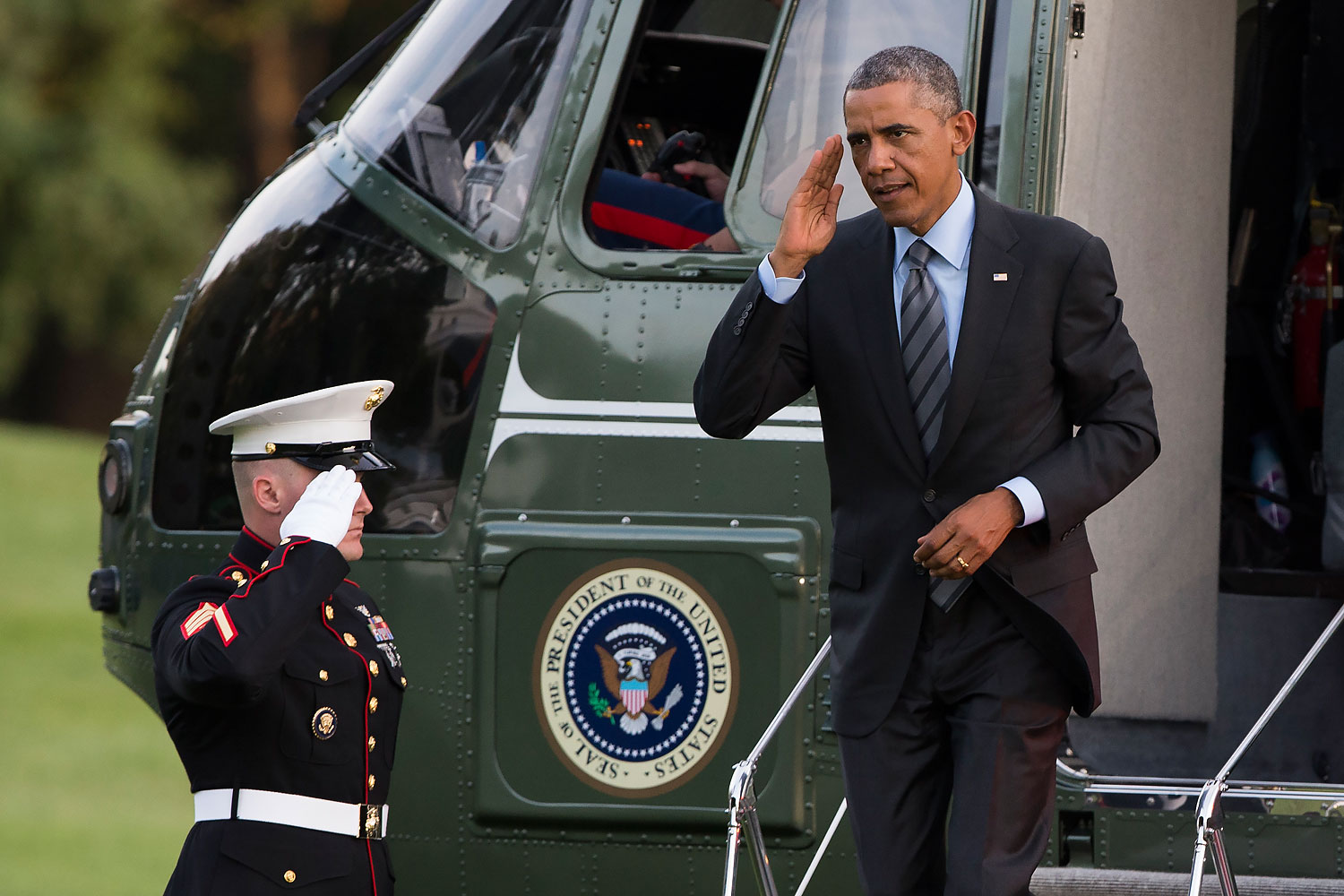 President Barack Obama salutes as he arrives on the South Lawn of the White House, in Washington, D.C., on Sept. 12, 2014 (Evan Vucci—AP)