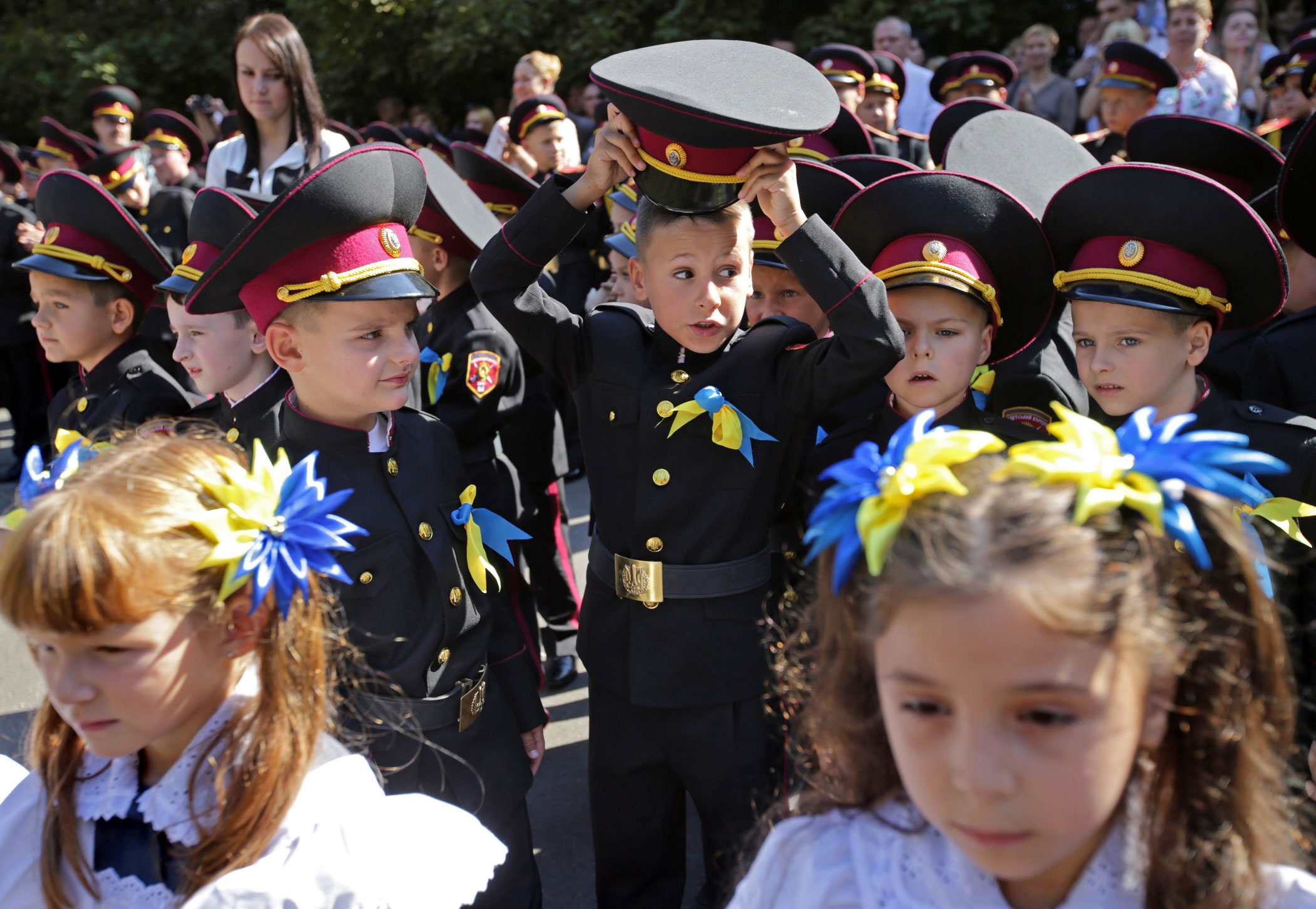 Ukrainian children from cadet's lyceum attend the first day of school, which marks the traditional start of the academic year in Kiev, Ukraine on Sept. 1, 2014.