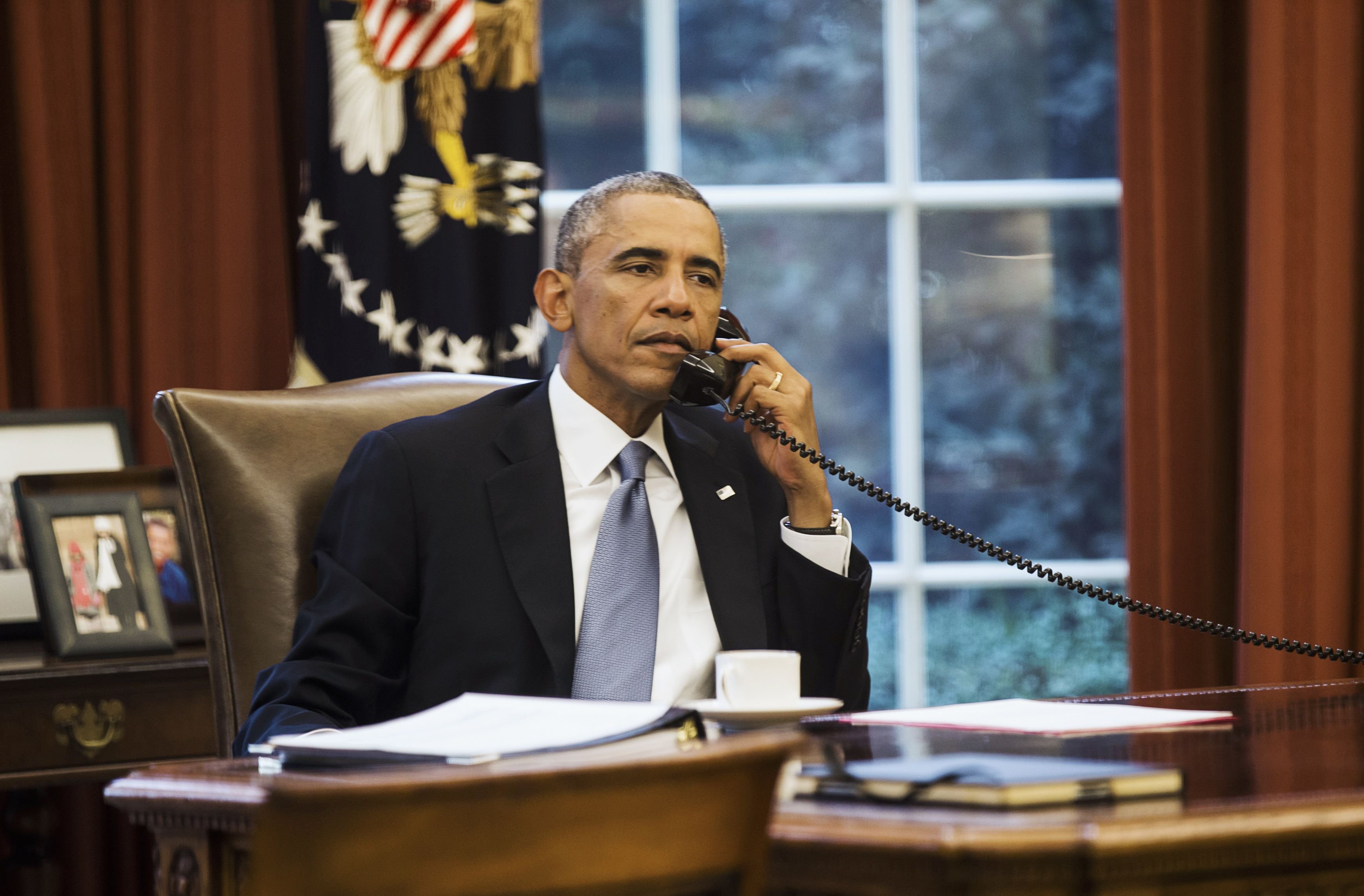 U.S. President Obama speaks on the phone with Saudi Arabia's King Abdullah from the Oval Office of the White House in Washington