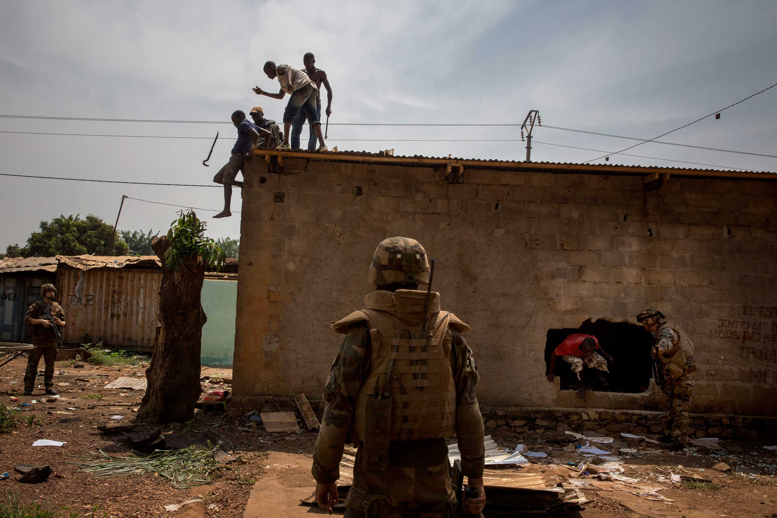 Feb. 3, 2014: French troops chase Christians looting Muslim houses in Bangui.