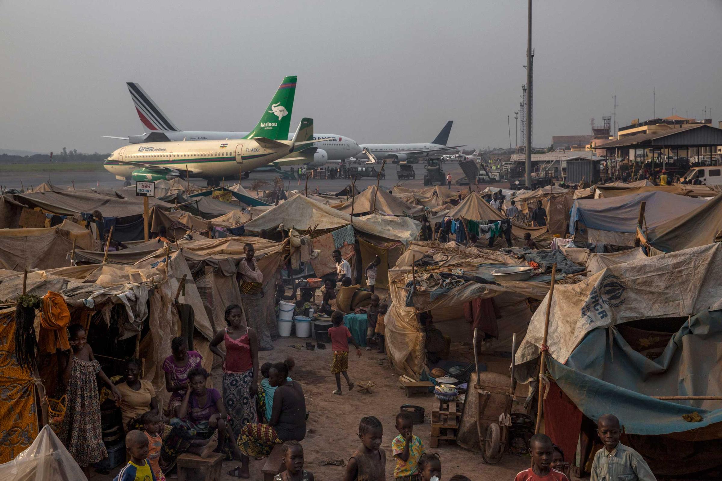 Jan. 28, 2014: The main displacement camp adjacent to Bangui's M'Poko International Airport, where thousands of people fled after the violence erupted in early December, now houses more than 100,000 people. The airport is secured by the French army.