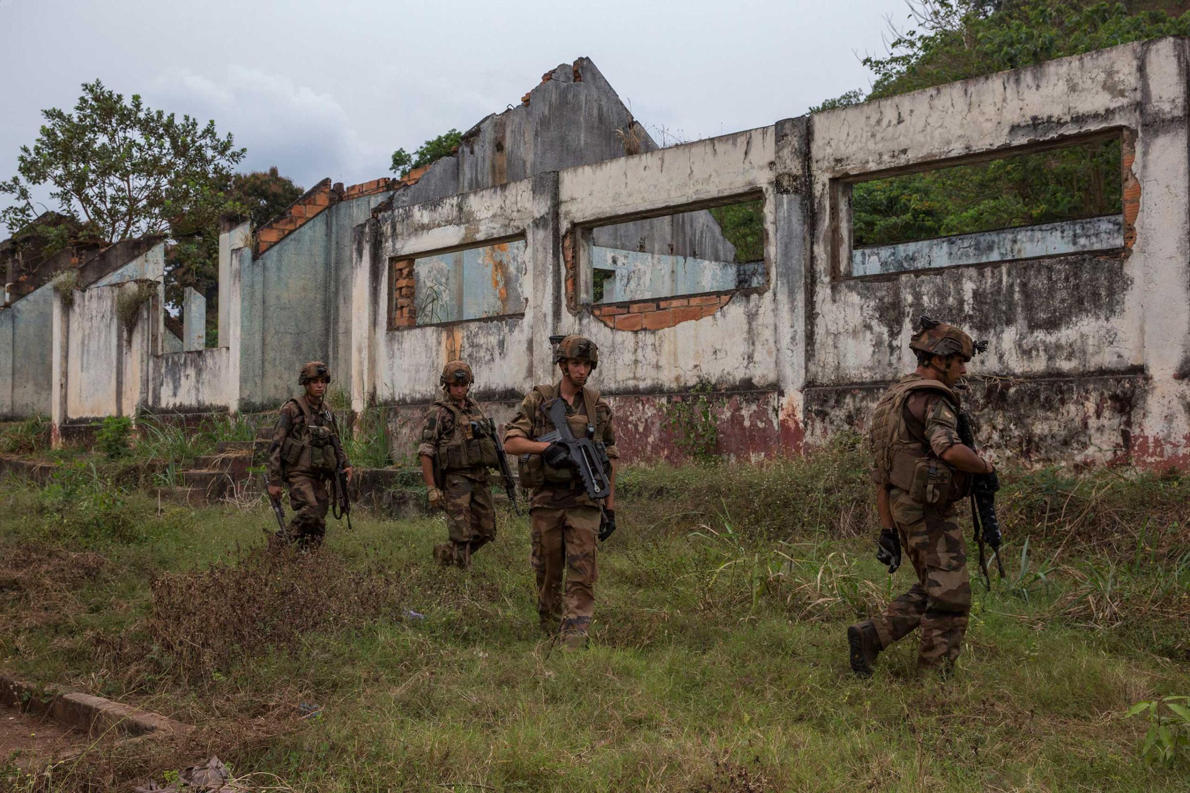 Jan. 28, 2014: After the last Séléka fighter left Camp Kasaï in Bangui, French troops look for weapons and ammunition.