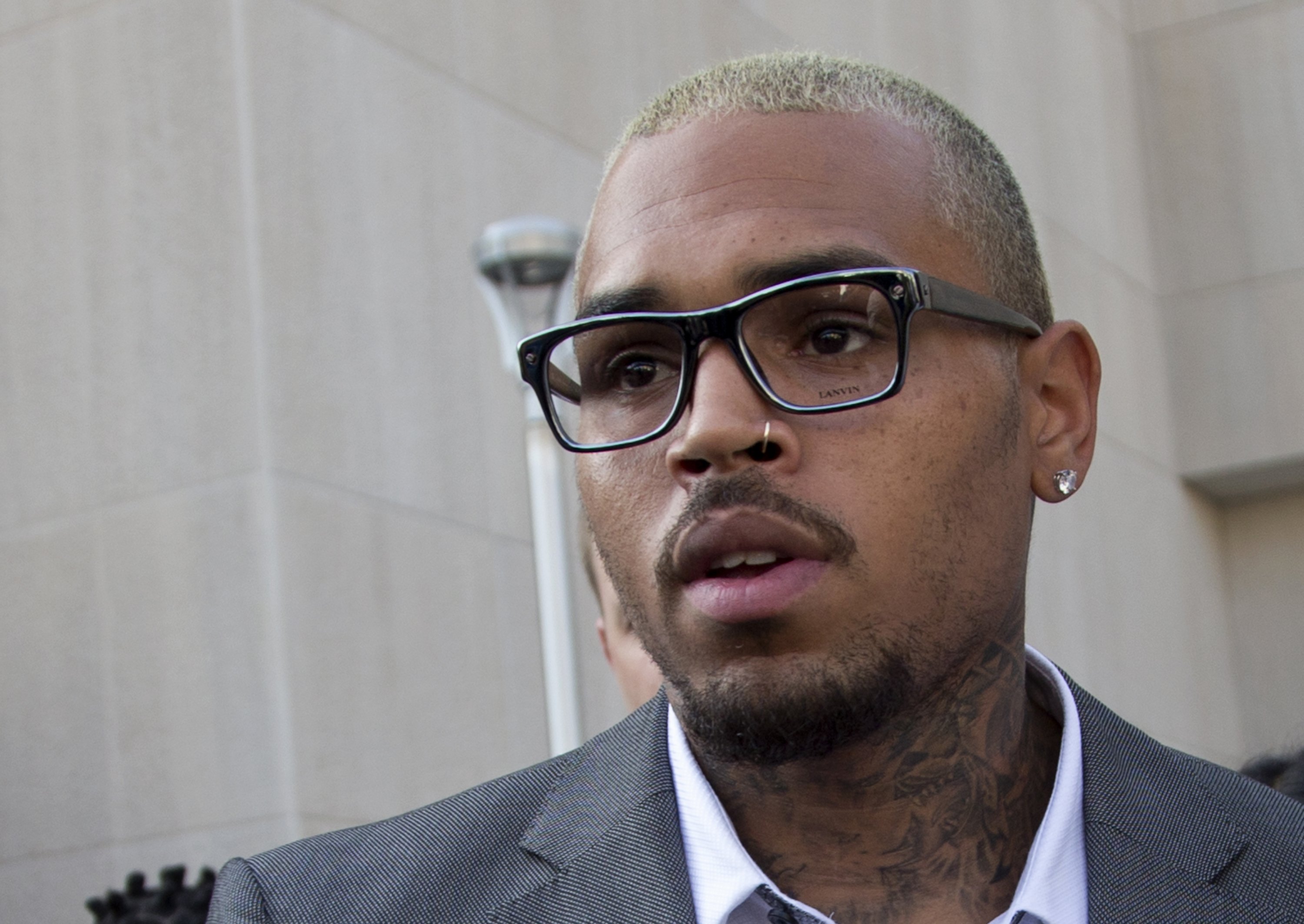 Singer Chris Brown leaves District of Columbia Superior Court after pleading guilty on a misdemeanor assault in Washington, Sept. 2, 2014. (Manuel Balce Ceneta—AP)