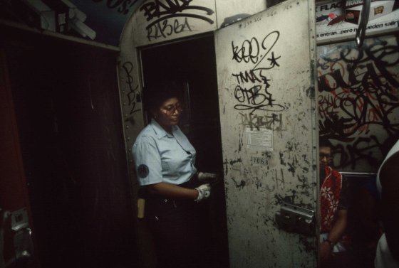 A subway conductor exits the conductor's cabin, 1981.