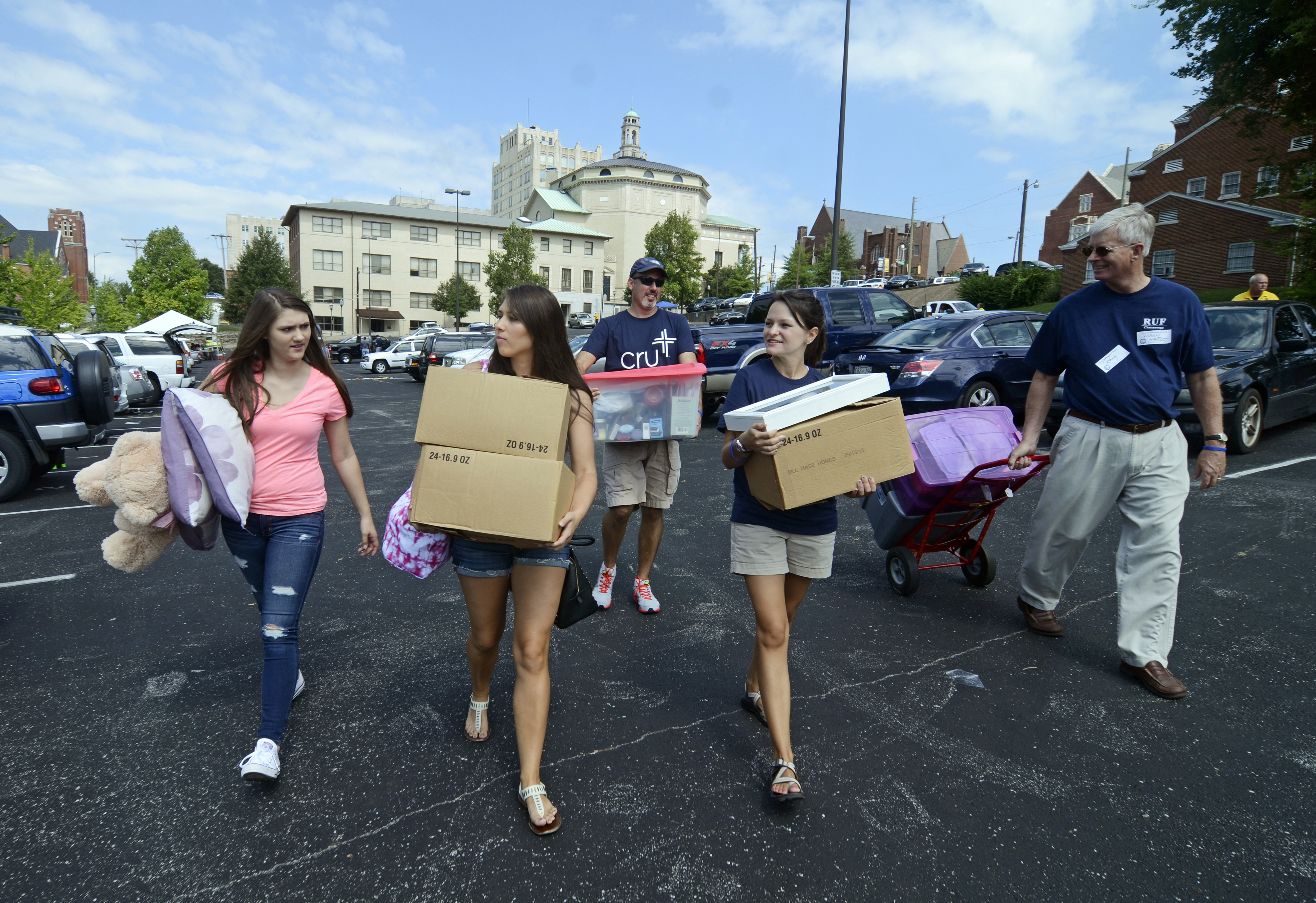Chloe Bradley, left front, and Logan Laney, right front, help Tori Bradley, middle front, move into campus housing on Aug. 14, 2014,  at the University of Tennessee at Chattanooga in Chattanooga, Tenn. (Angela Lewis Foster—AP)
