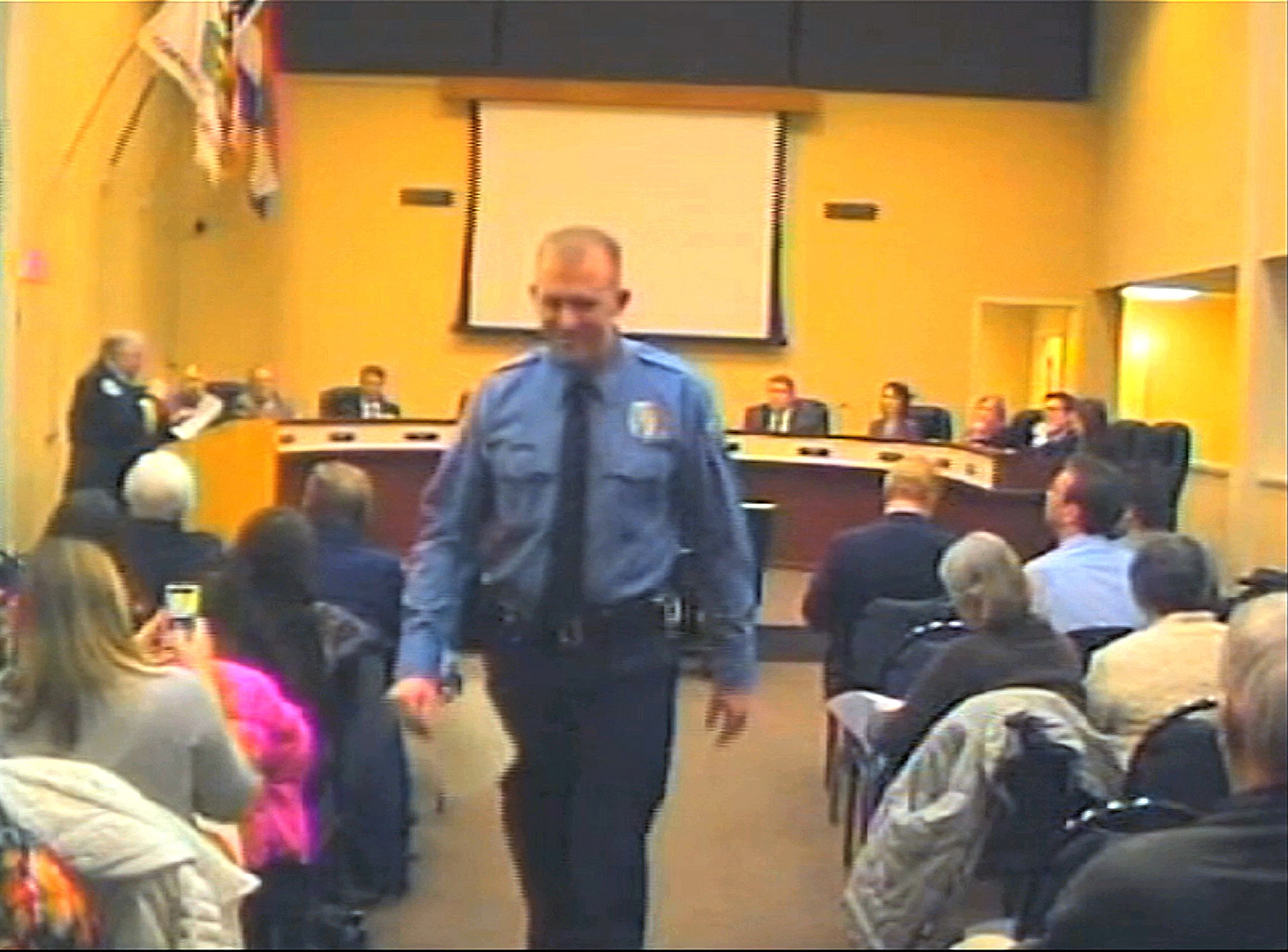 Officer Darren Wilson, seen in a video provided by the City of Ferguson, attends a city council meeting in Ferguson, Mo. (City of Ferguson/AP)