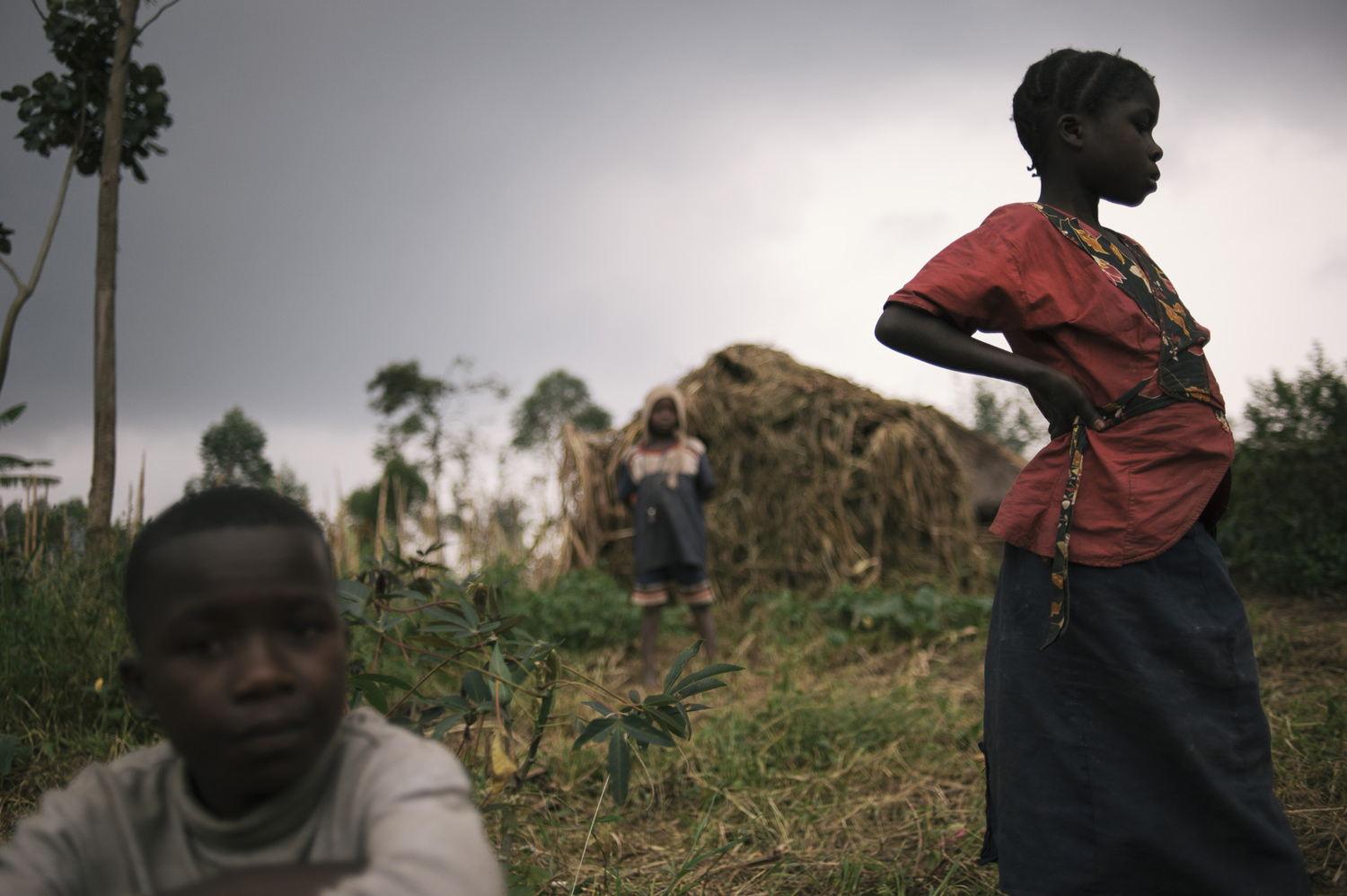 Congolese children stand on the outskirts of Nyabiondo. The town was the scene of heavy fighting earlier this year as government forces battled with APCLS rebels, causing much of the population to flee into the surrounding forest, July 21, 2014.