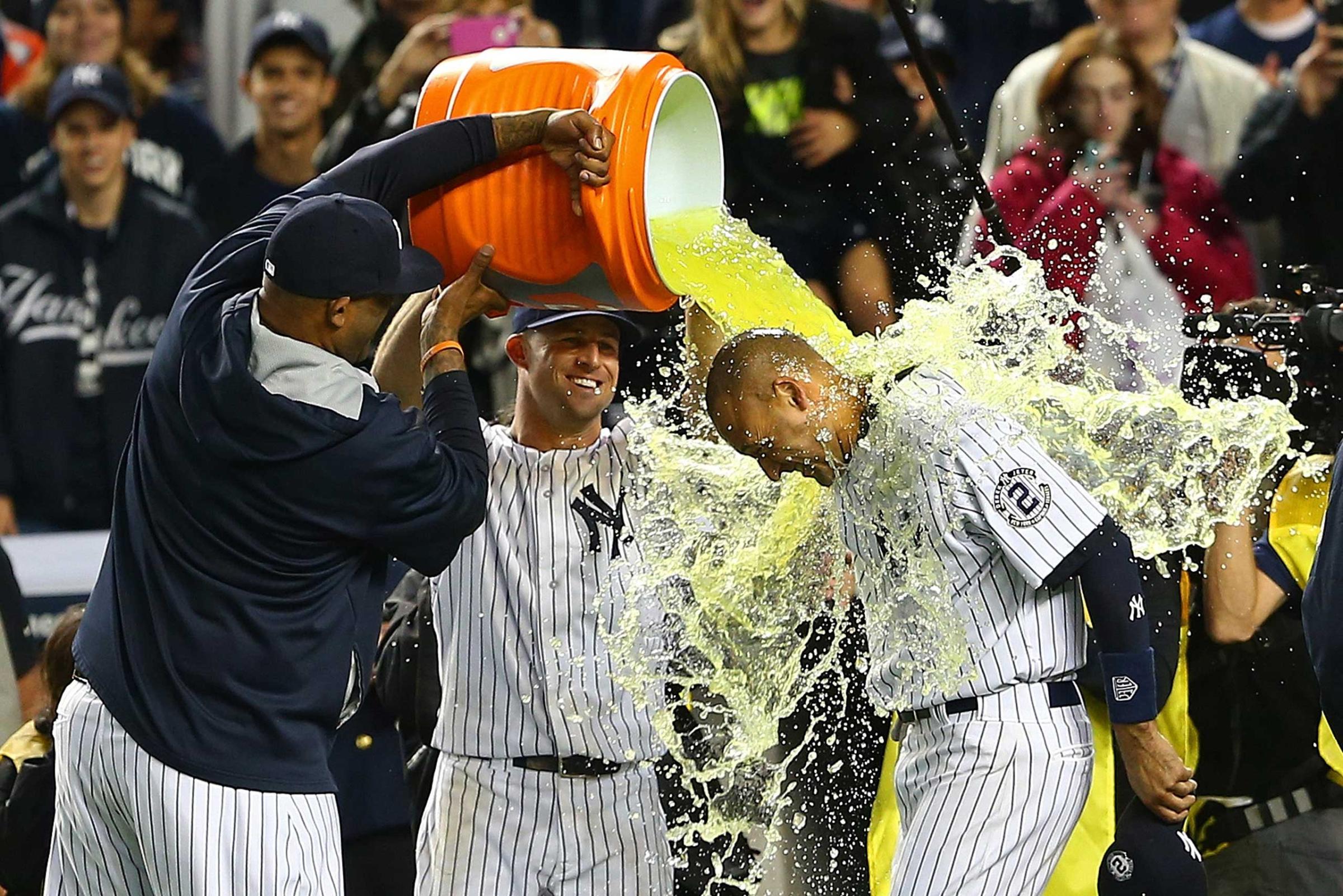 CC Sabathia and Brett Gardner dump Gatorade on Derek Jeter after he hit a game winning RBI hit in the ninth inning against the Baltimore Orioles in his last game ever at Yankee Stadium on Sept. 25, 2014.