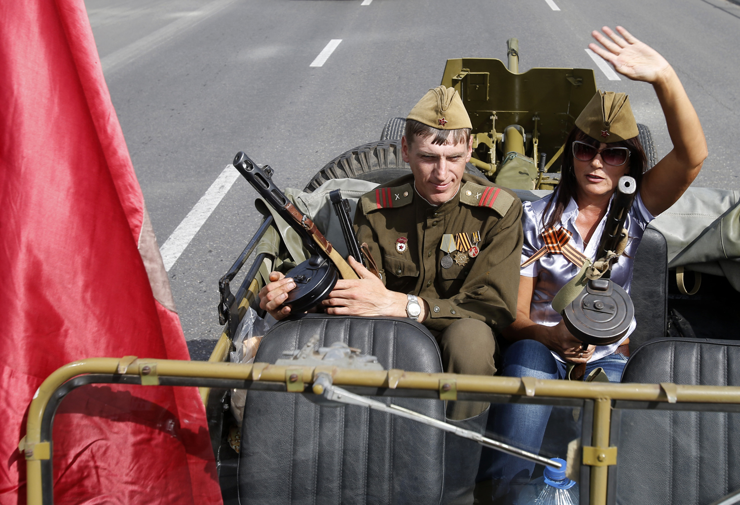 People dressed in old Soviet uniforms attend a parade in the town of Luhansk, eastern Ukraine, on Sept. 14, 2014 (Darko Vojinovic — AP)