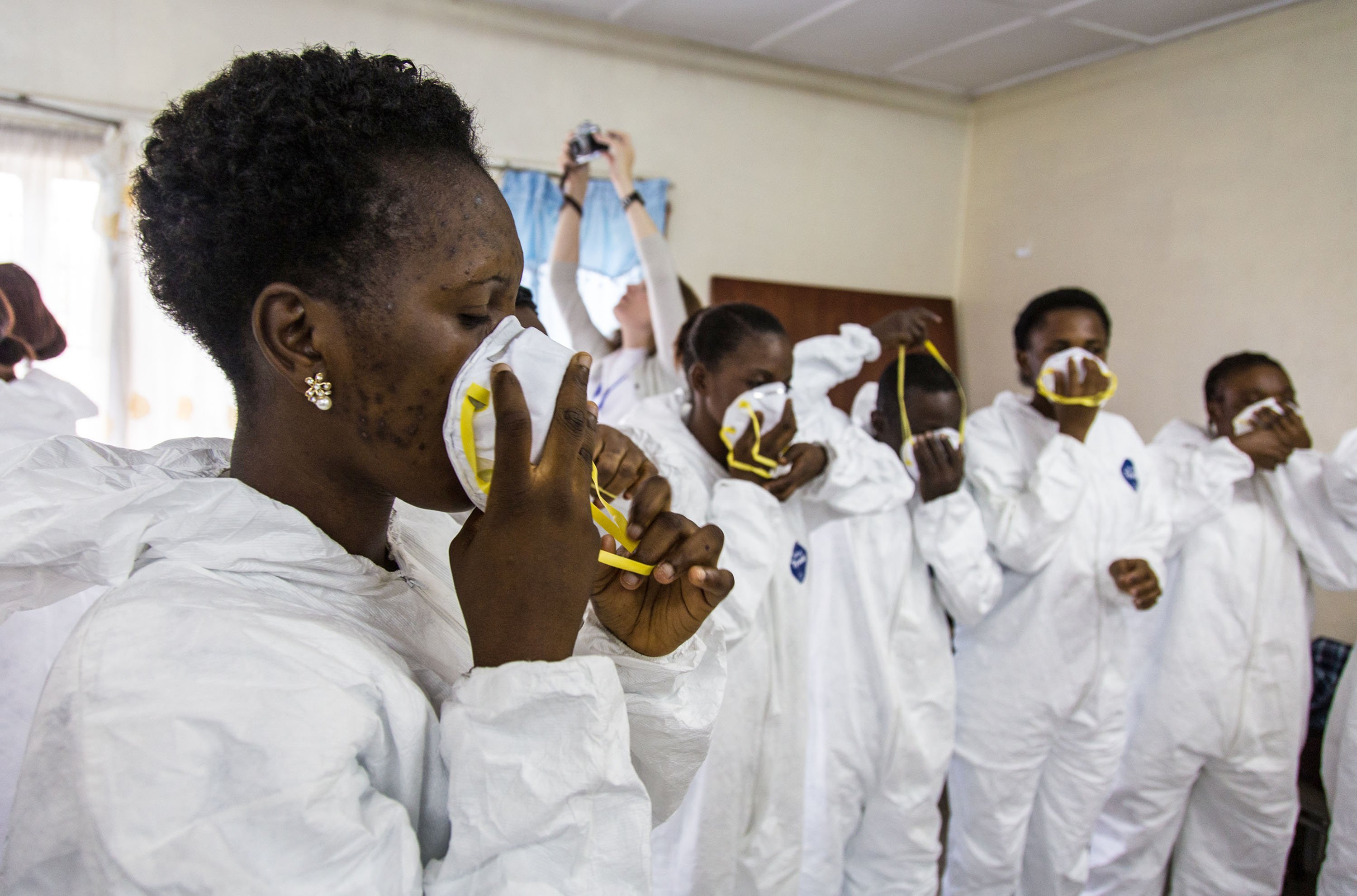 Nurses train to use Ebola protective gear with World Health Organization, WHO, workers, in Freetown, Sierra Leone on Sept. 18, 2014. (Michael Duff—AP)
