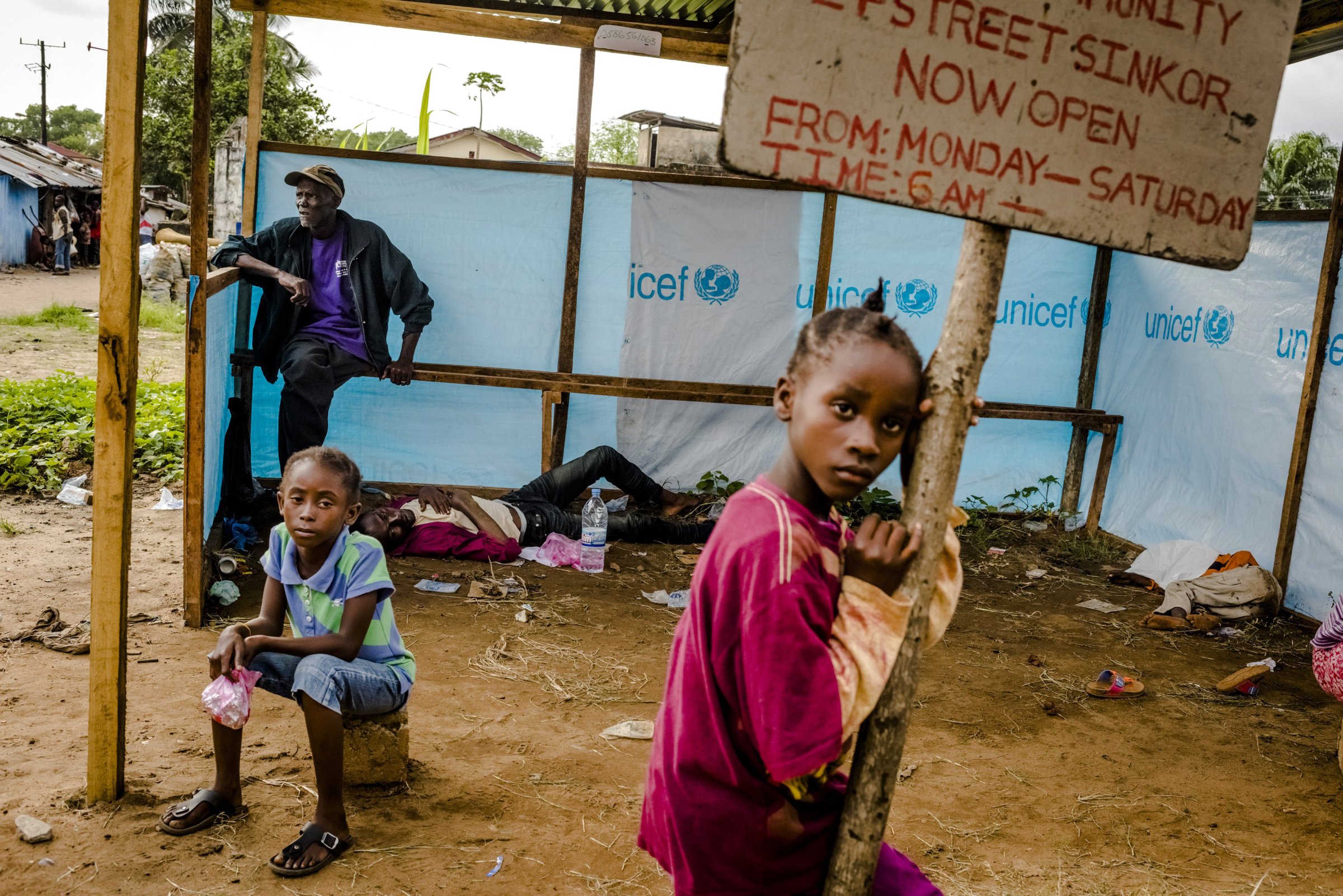 People wait to be admitted into an Ebola treatment facility in Monrovia, Liberia, on Sept. 5, 2014.