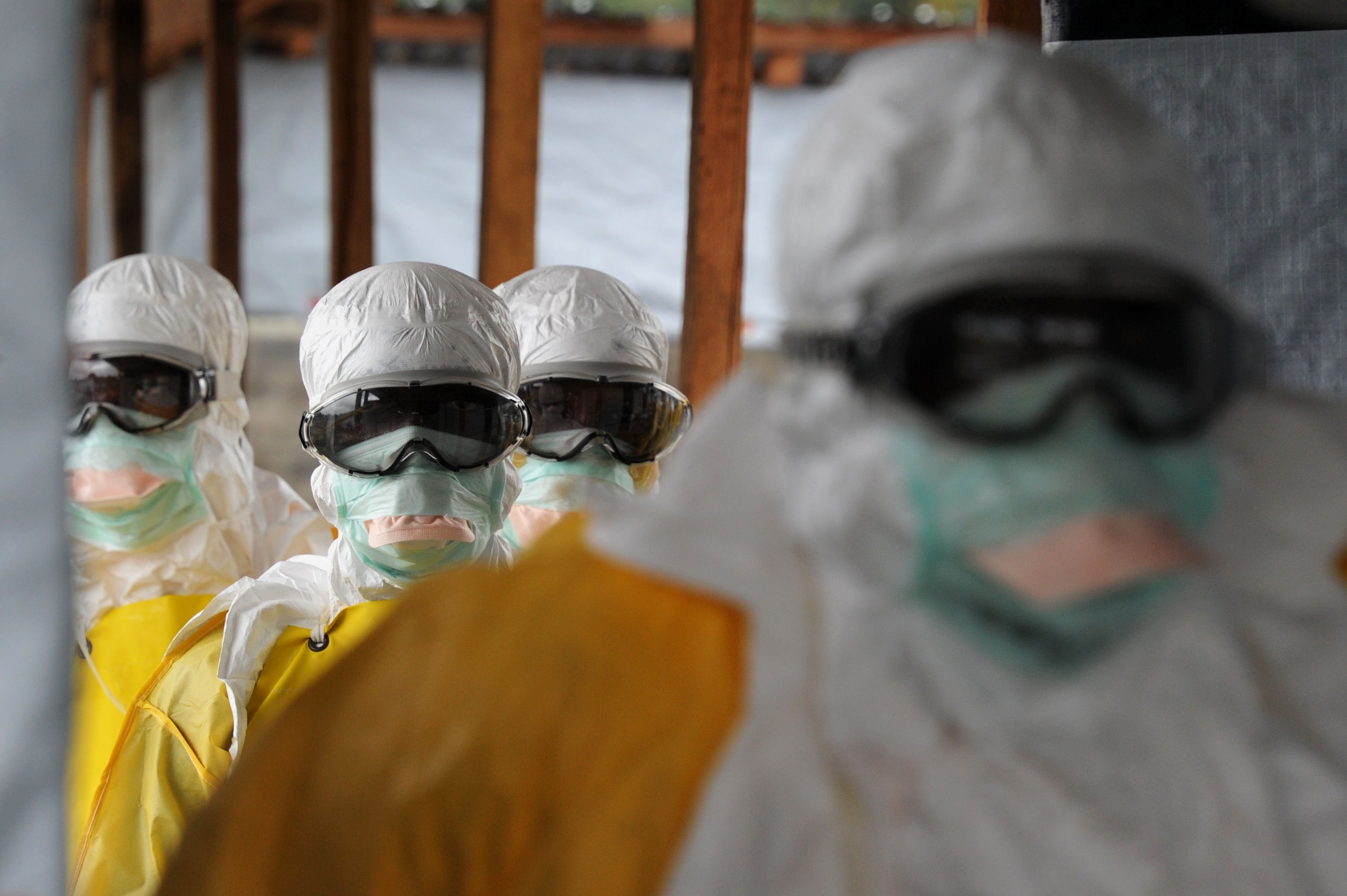 Health care workers, wearing protective suits, leave a high-risk area at the French NGO Medecins Sans Frontieres (Doctors without borders) Elwa hospital in Monrovia, Liberia on Aug. 30, 2014. (Dominique Faget—AFP/Getty Images)