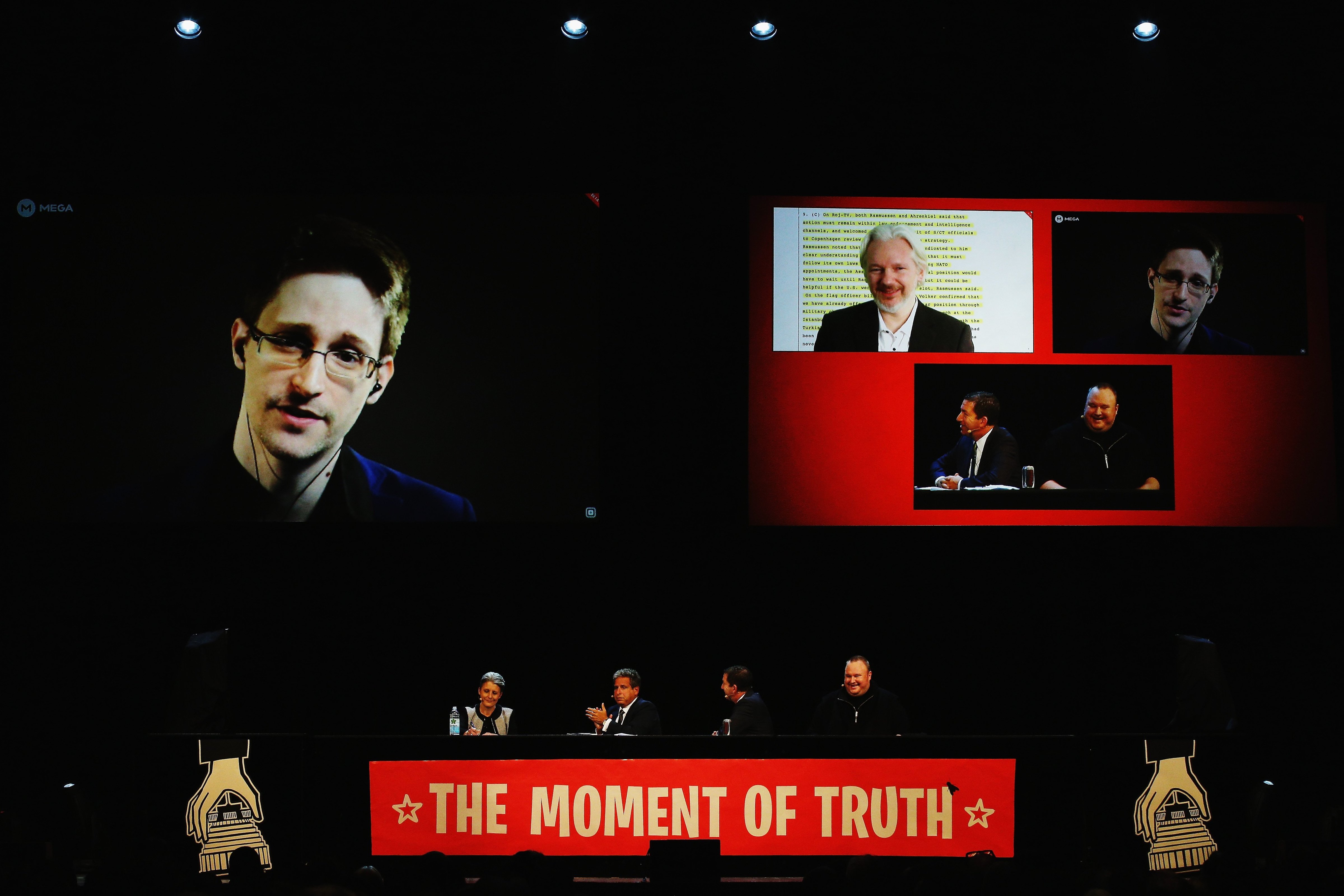 Edward Snowden, Julian Assange, Internet Party leader Laila Harre, Robert Amsterdam, Glenn Greenwald and Kim Dotcom discuss the revelations about New Zealand's mass surveillance at Auckland Town Hall in Auckland, New Zealand on Sept. 15, 2014. (Hannah Peters—Getty Images)
