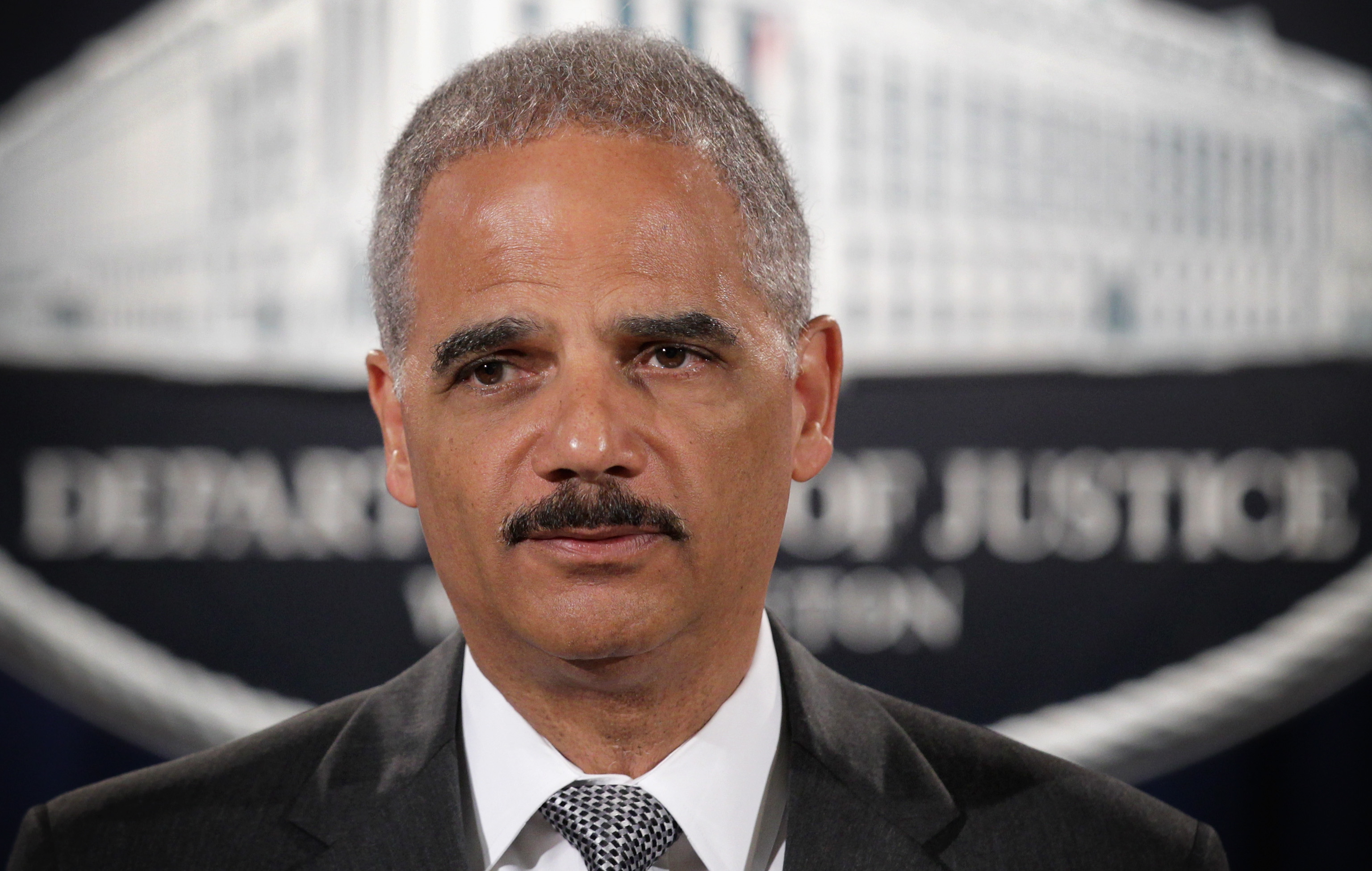 Attorney General Eric Holder makes a separated during a major financial fraud announcement press conference on Aug. 21, 2014 at the Justice Department in Washington, DC. (Alex Wong—Getty Images)