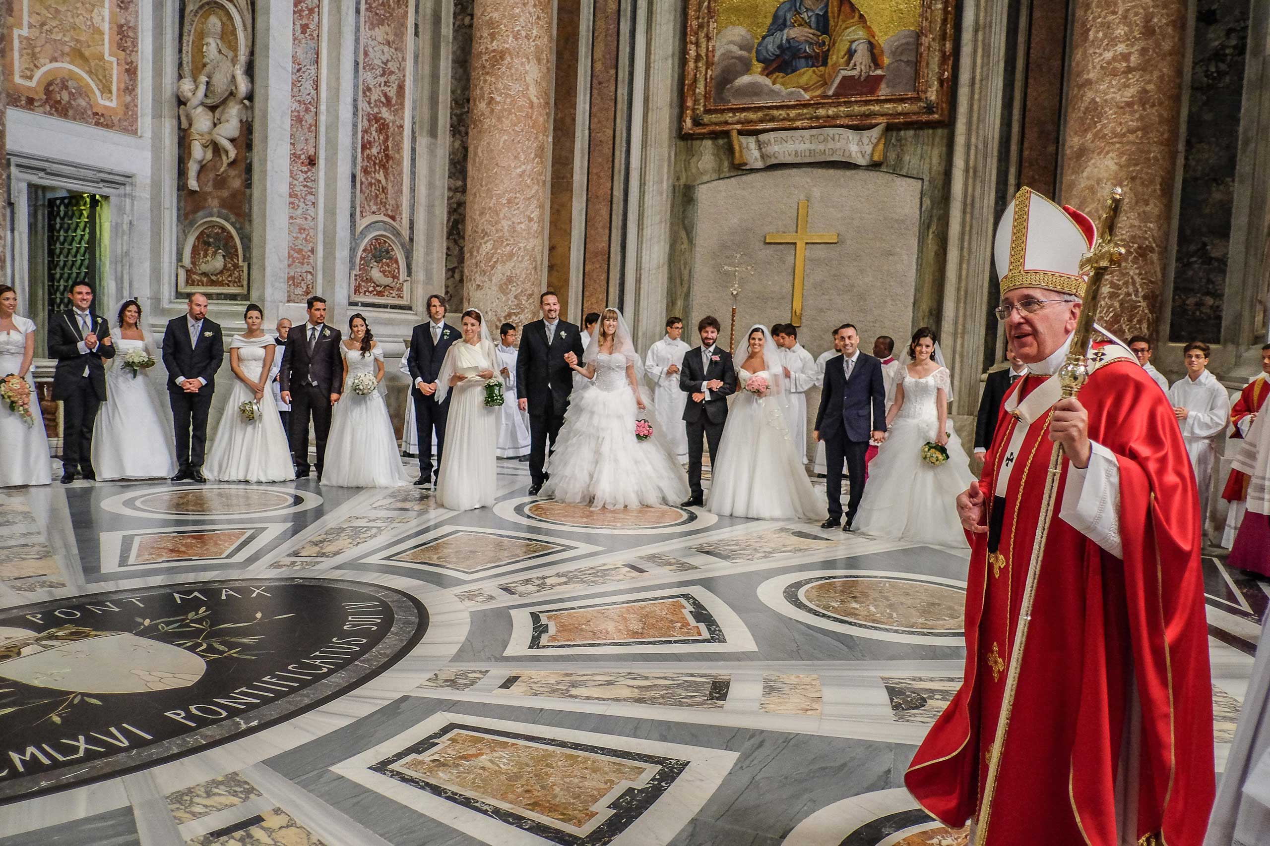 Pope Francis celebrates the wedding of 20 couples in St. Peter's Basilica in Vatican City, Italy on Sept. 14, 2014.