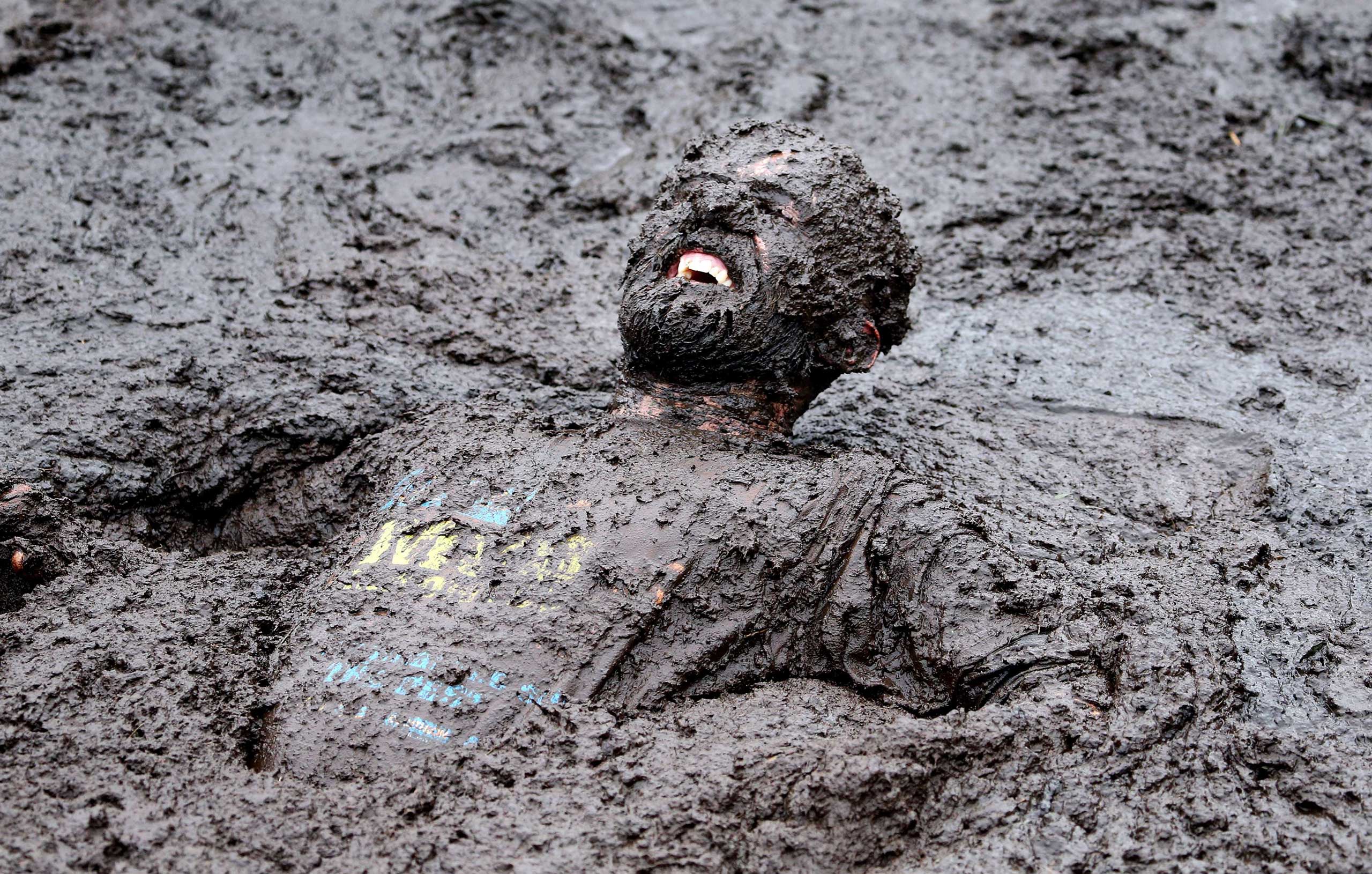 A competitor competes in the Mud Madness race, at Foymore Lodge in Portadown, County Armagh on Sept.14, 2014.