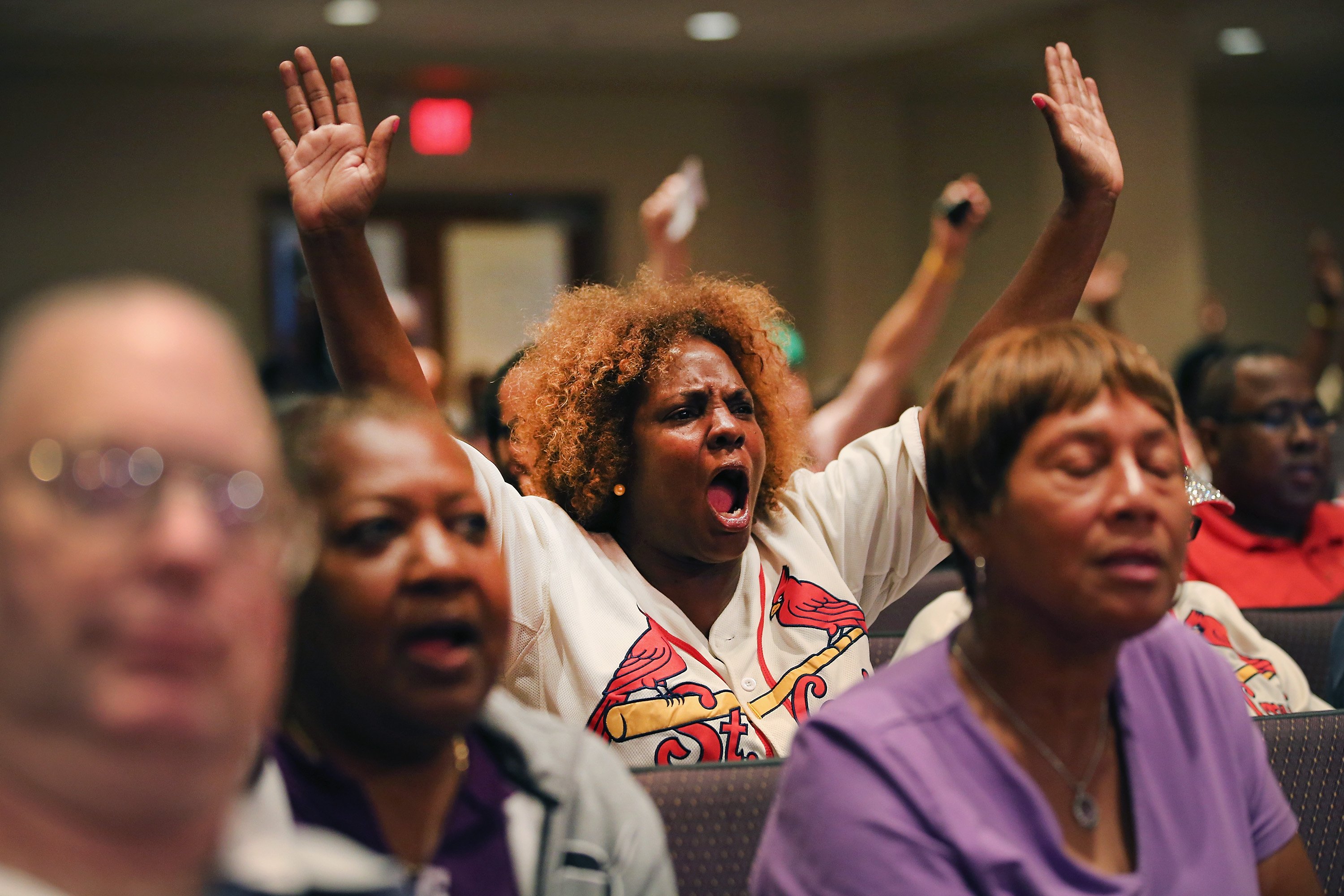 Residents shout out during the Ferguson city-council meeting on Sept. 9, 2014, in Ferguson, Mo. (Scott Olson—Getty Images)