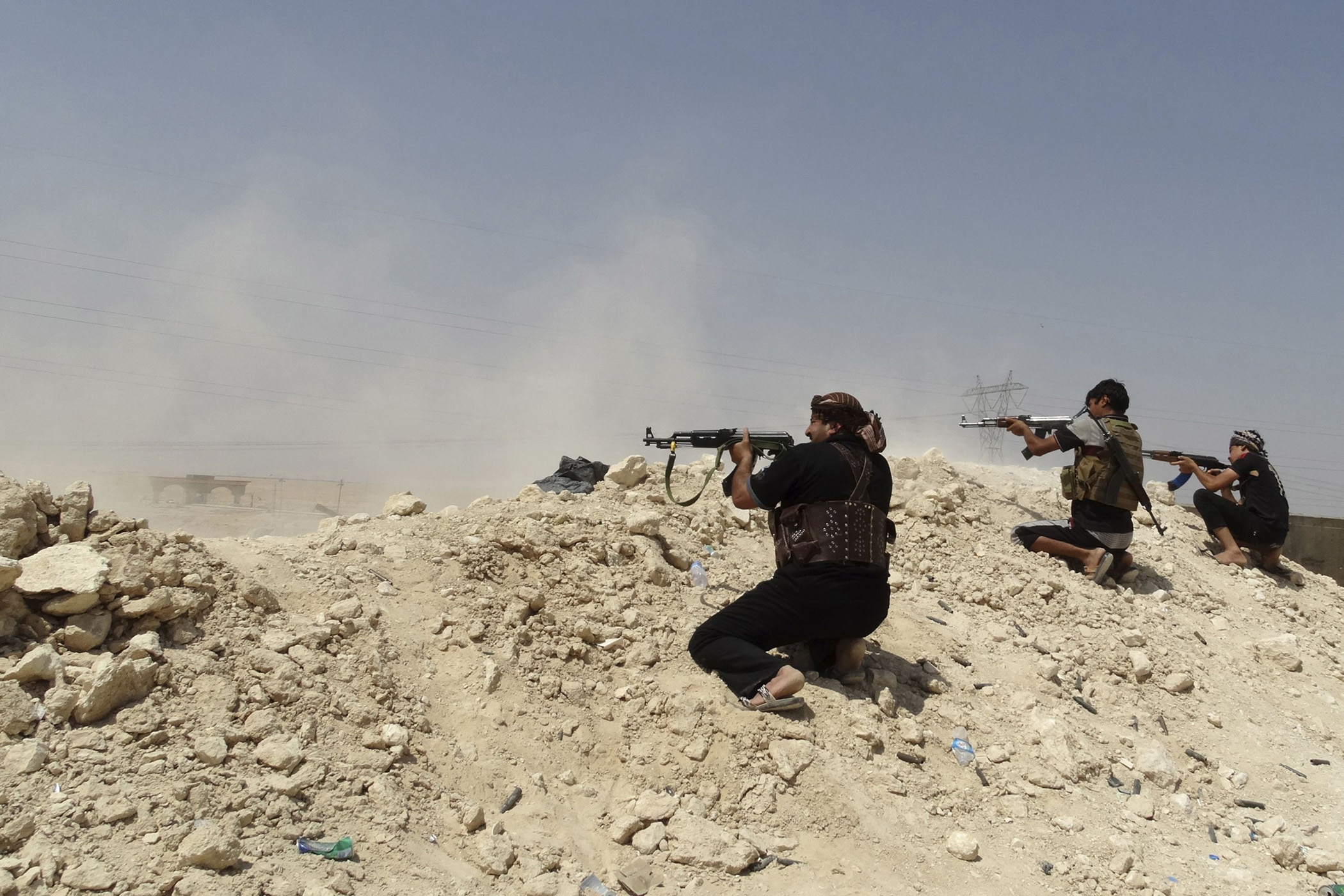 Tribal fighters seen during a battle with ISIS militants, in Haditha, Iraq, Aug. 25, 2014.