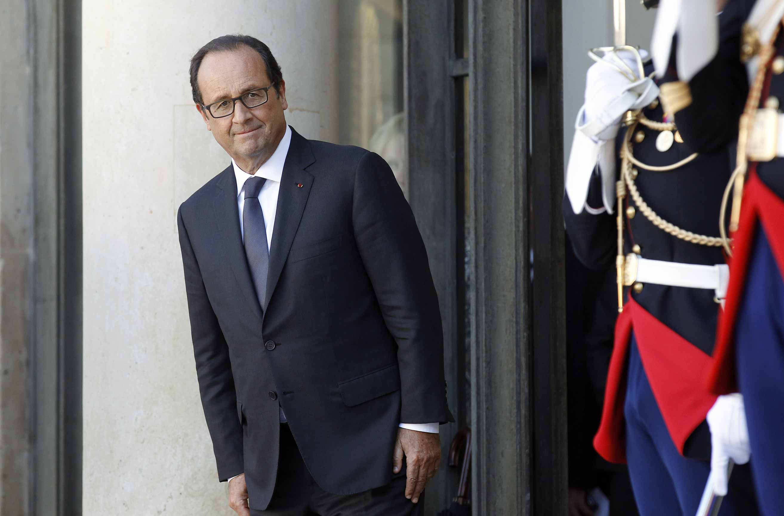 Hollande leaves the Élysée Palace after a press conference with his Czech counterpart, Milos Zeman, on Sept. 9 (Chesnot—Getty Images)