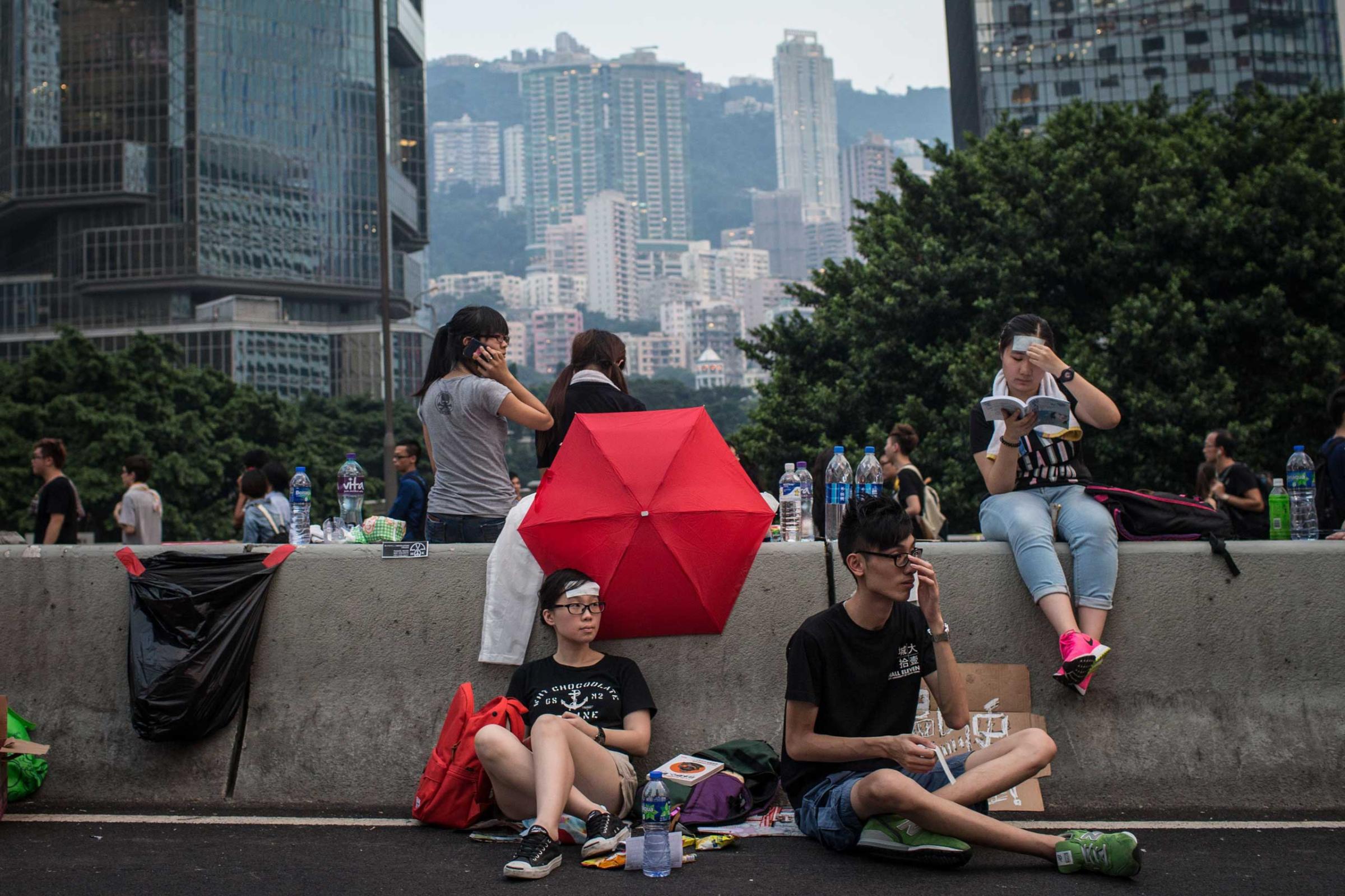Protesters relax on the streets outside the Hong Kong Government Complex on Sept. 30, 2014 in Hong Kong, Hong Kong.