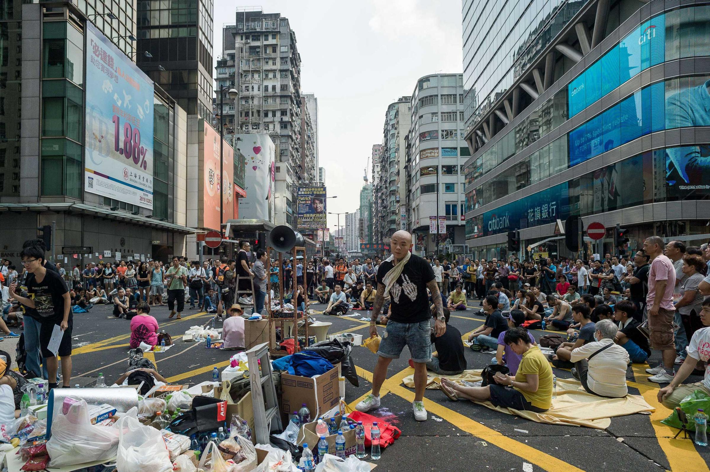 Pro-democracy demonstrators rest during a protest in Hong Kong on Sept. 30, 2014.