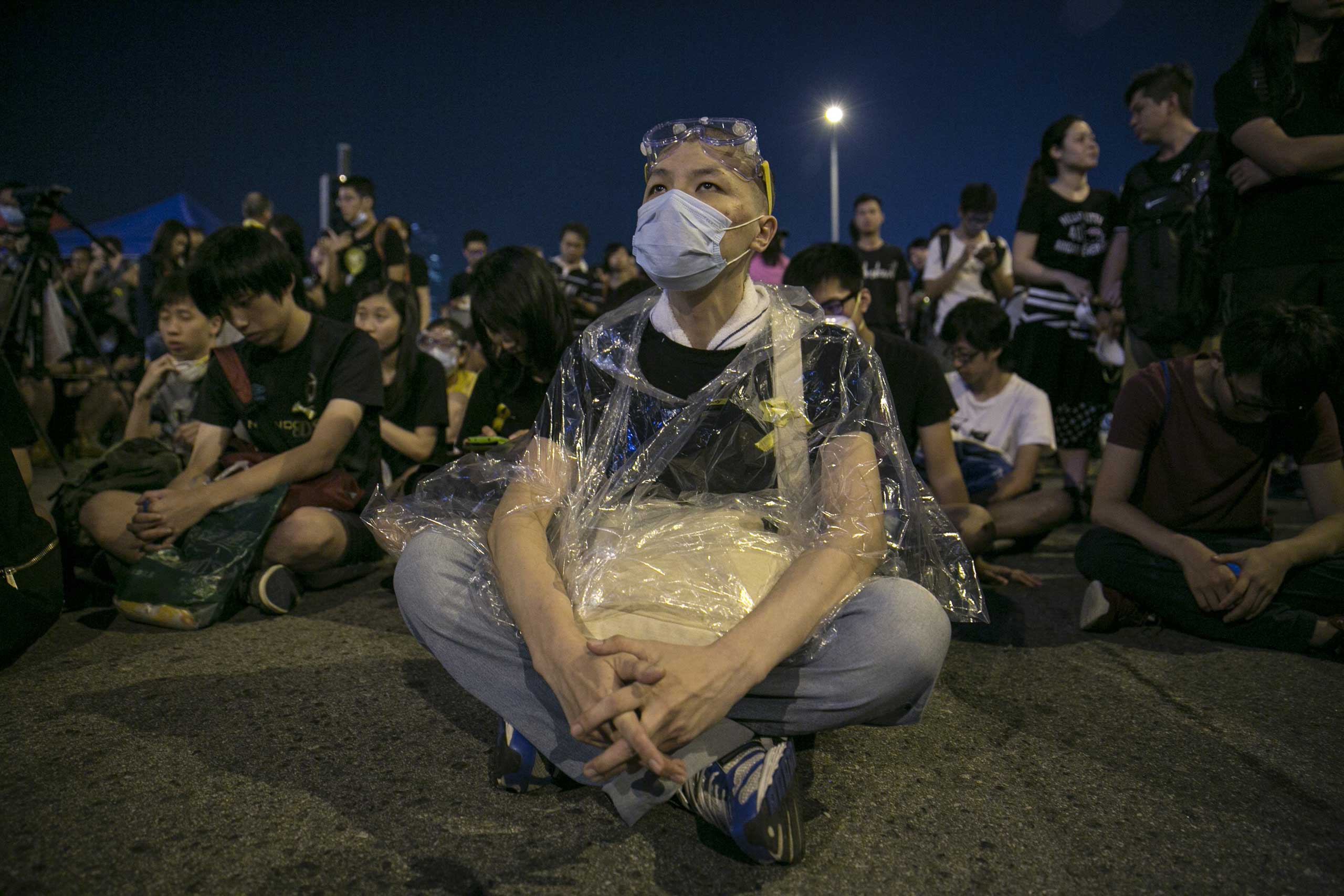 Protesters sit behind a government building as the standoff continues Oct. 5, 2014 in Hong Kong.