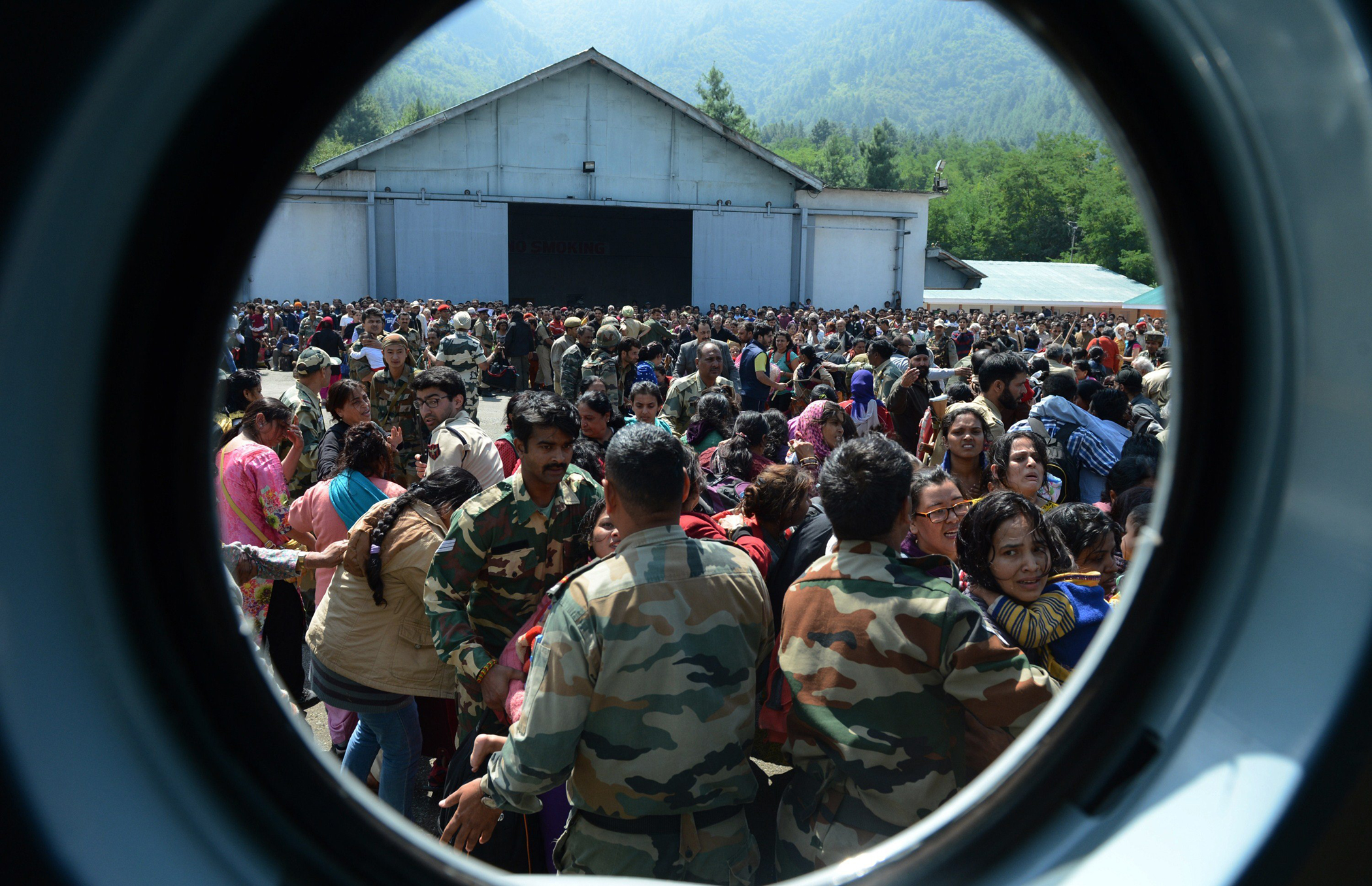 Tourists wait to be evacuated by Indian Air Force helicopters during rescue and relief operations following flooding in Srinagar on Sept. 10, 2014.