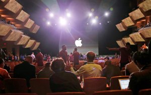 Guests prepare for the start of an Apple event on Tuesday, Sept. 9, 2014, in Cupertino, Calif. Along with larger iPhones, Apple is poised to unveil a wearable device — marking its first major entry in a new product category since the iPad's debut in 2010.
