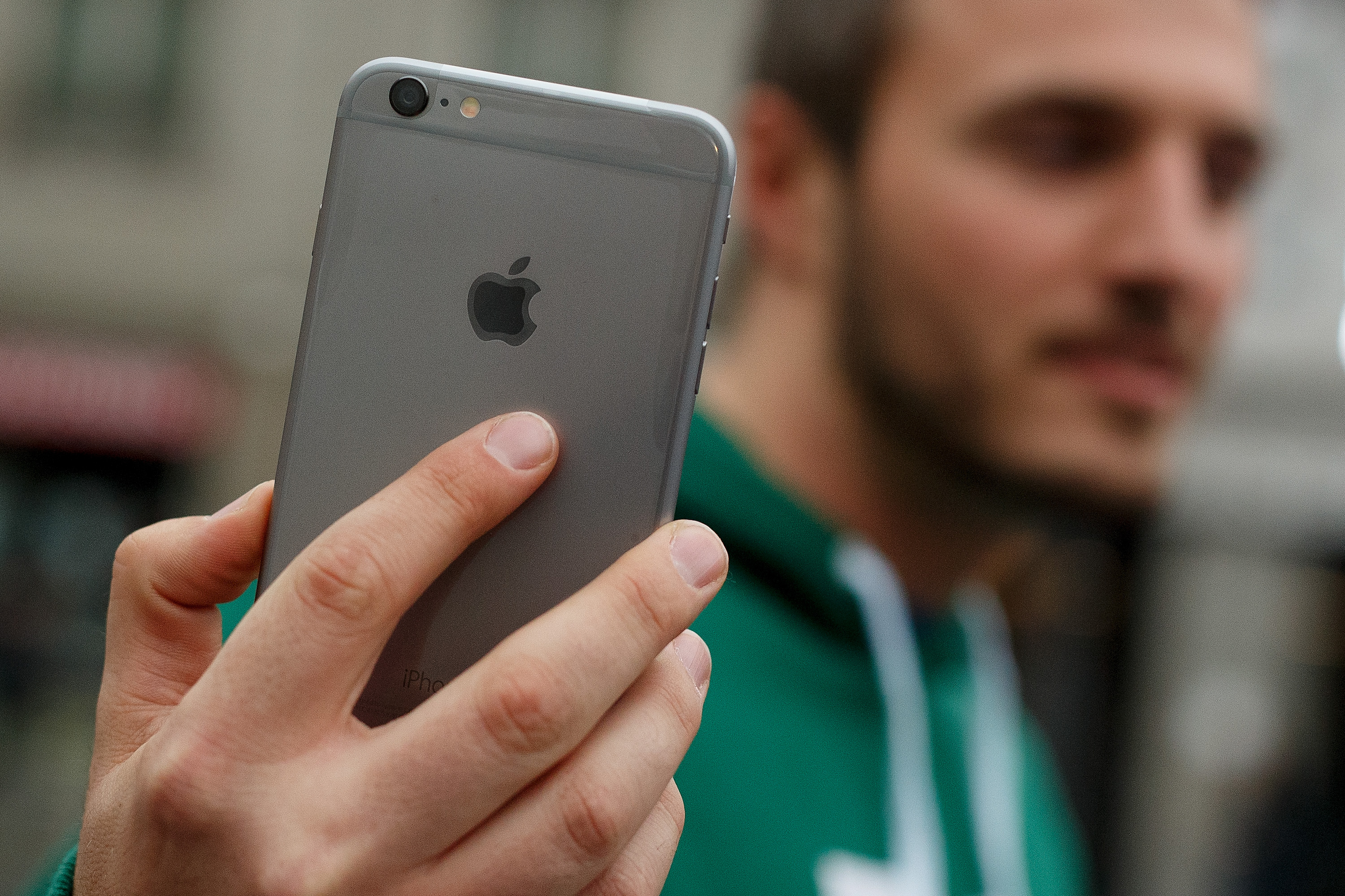 A man shows his new iPhone outside Puerta del Sol Apple Store as Apple launches iPhone 6 and iPhone 6 Plus on September 26, 2014 in Madrid, Spain. (Pablo Blazquez Dominguez—Getty Images)