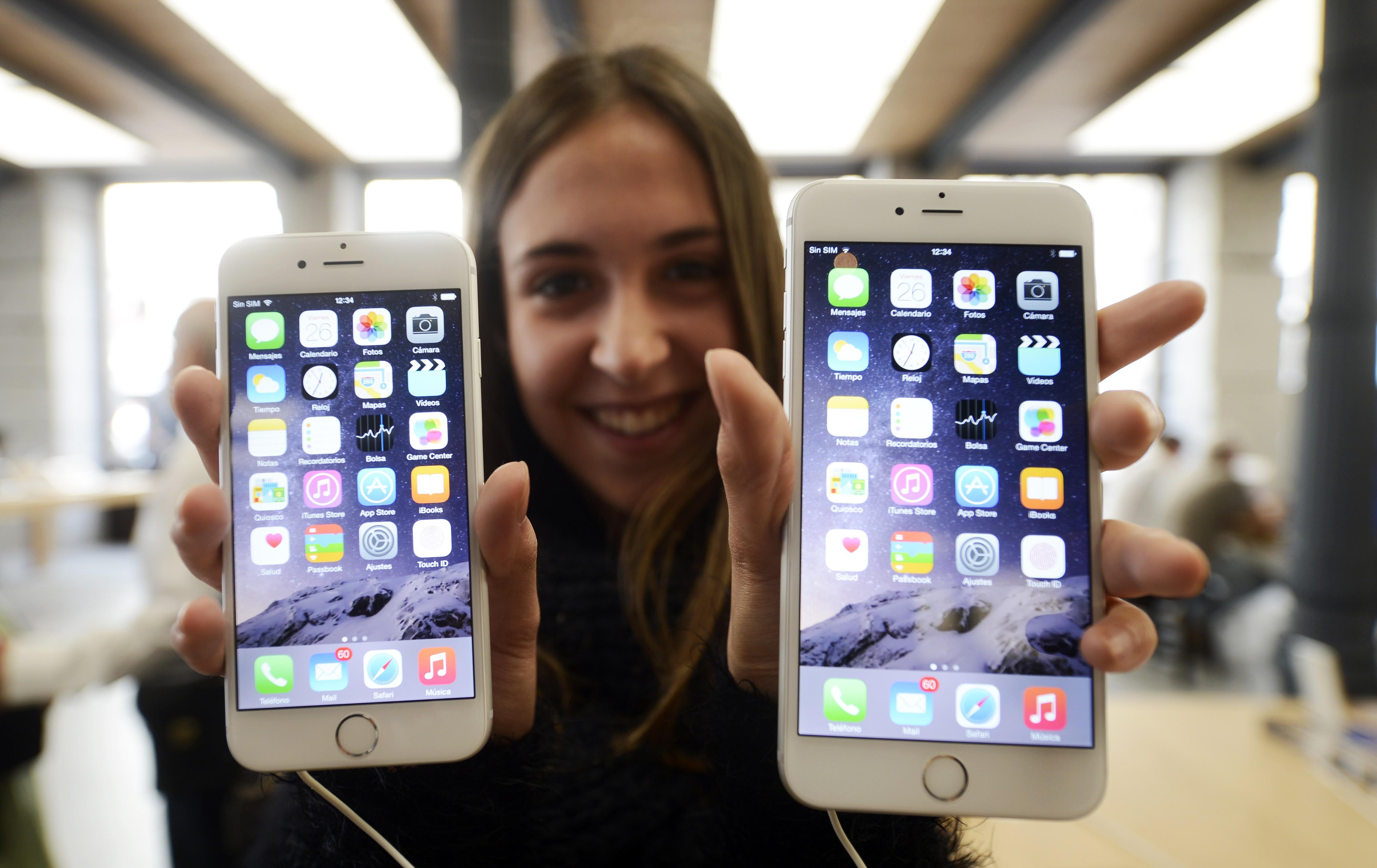 A customer shows the new products of Apple, iPhone 6 and iPhone 6 Plus, at an Apple Store in Madrid, Spain, on September 26, 2014. (Anadolu Agency&mdash;Getty Images)