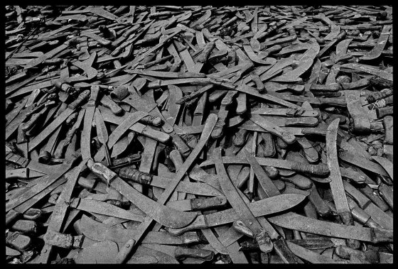 As the vanquished Hutus fled into Tanzania, they had to leave at the border the weapons with which they had committed the genocide, Rwanda, 1994.