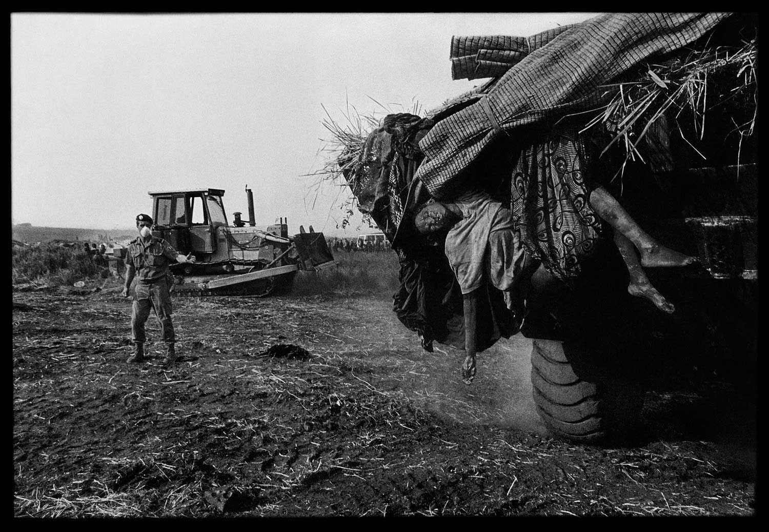 To help stop the deadly momentum of the disease, the French army mobilized earth-moving equipment in Zaire to remove and bury the dead en masse, Zaire, 1994.