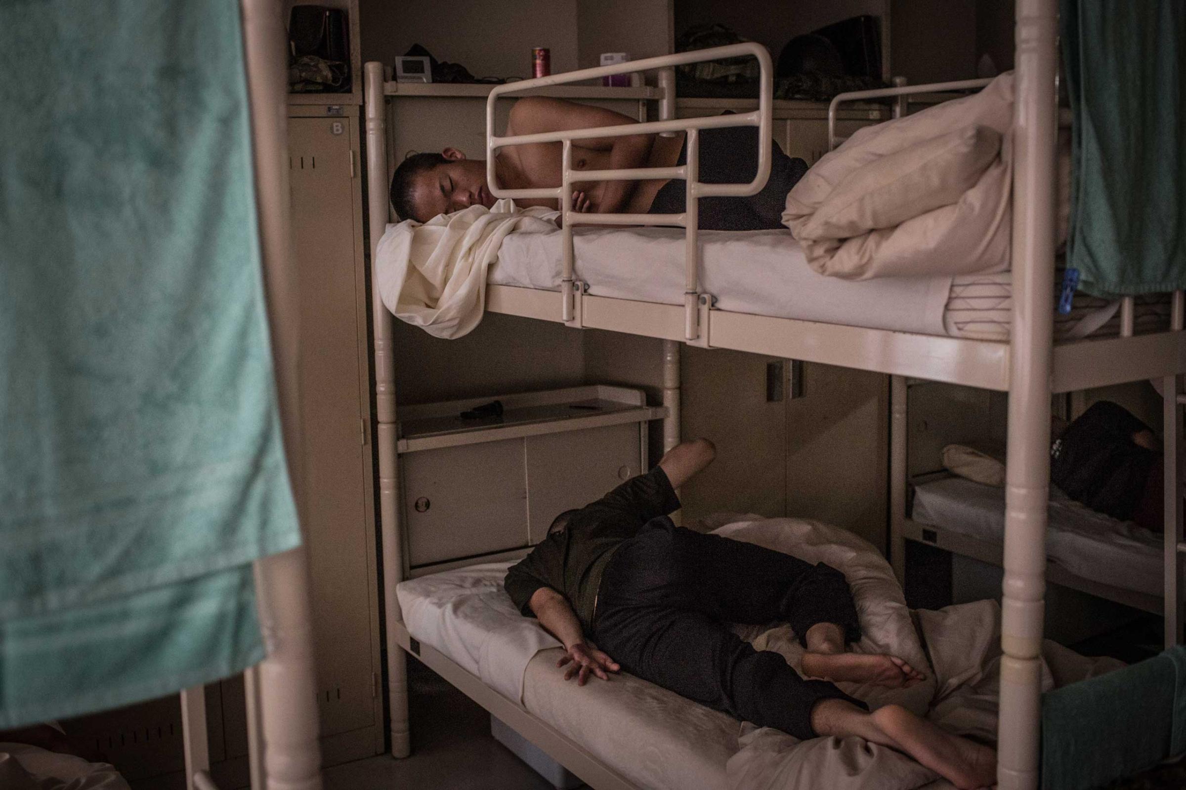 Students sleep in a dormitory.